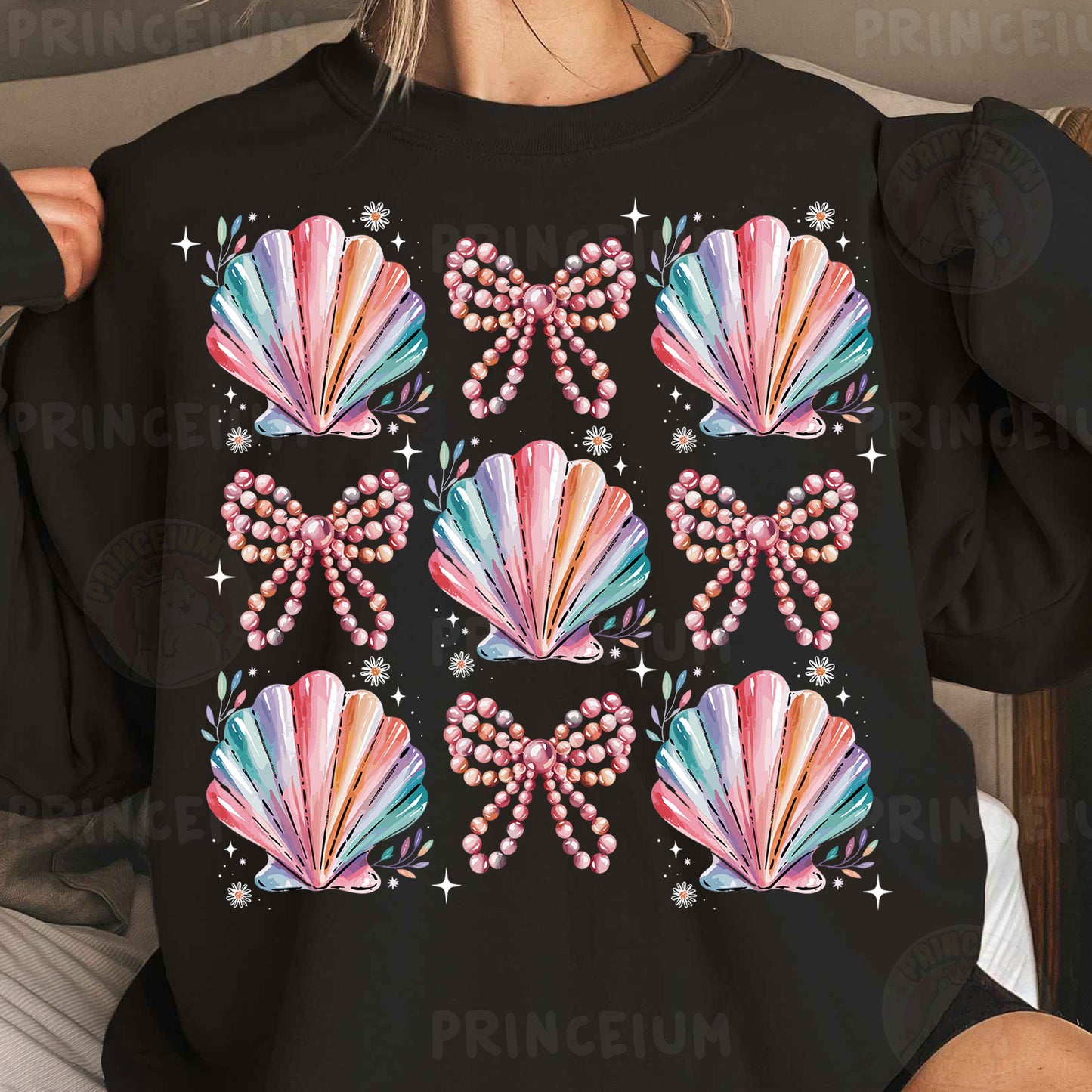 a woman wearing a black shirt with colorful seashells on it