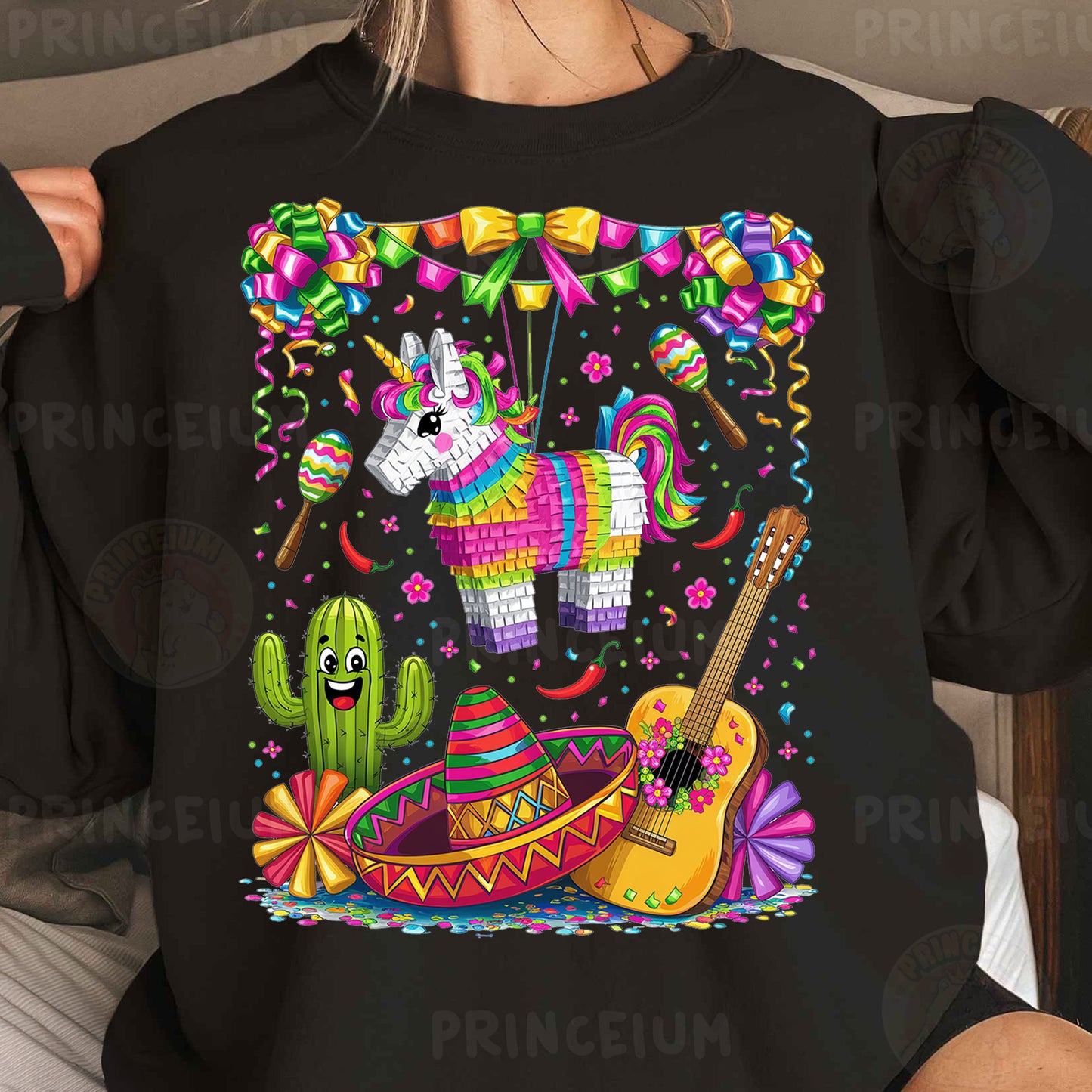 a woman wearing a black shirt with an image of a unicorn and a guitar