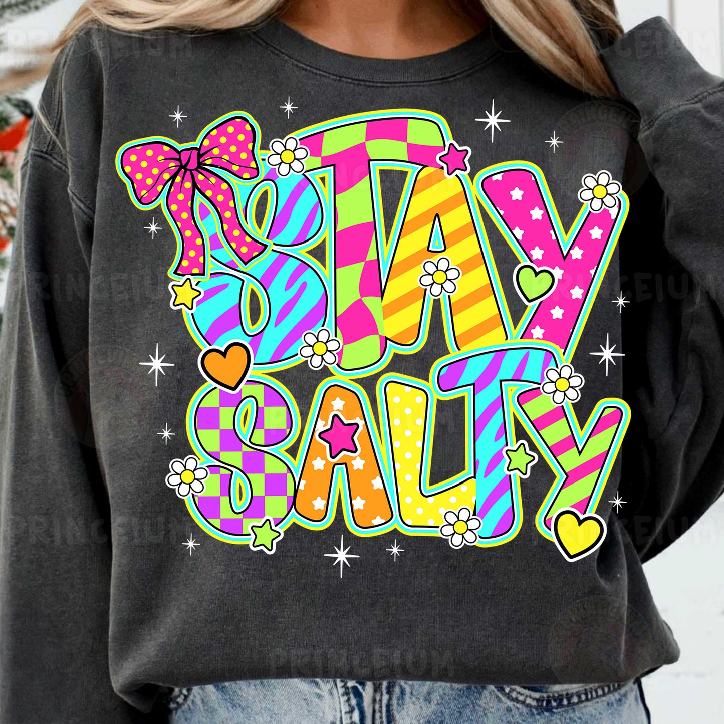 a woman wearing a sweatshirt that says stay salty