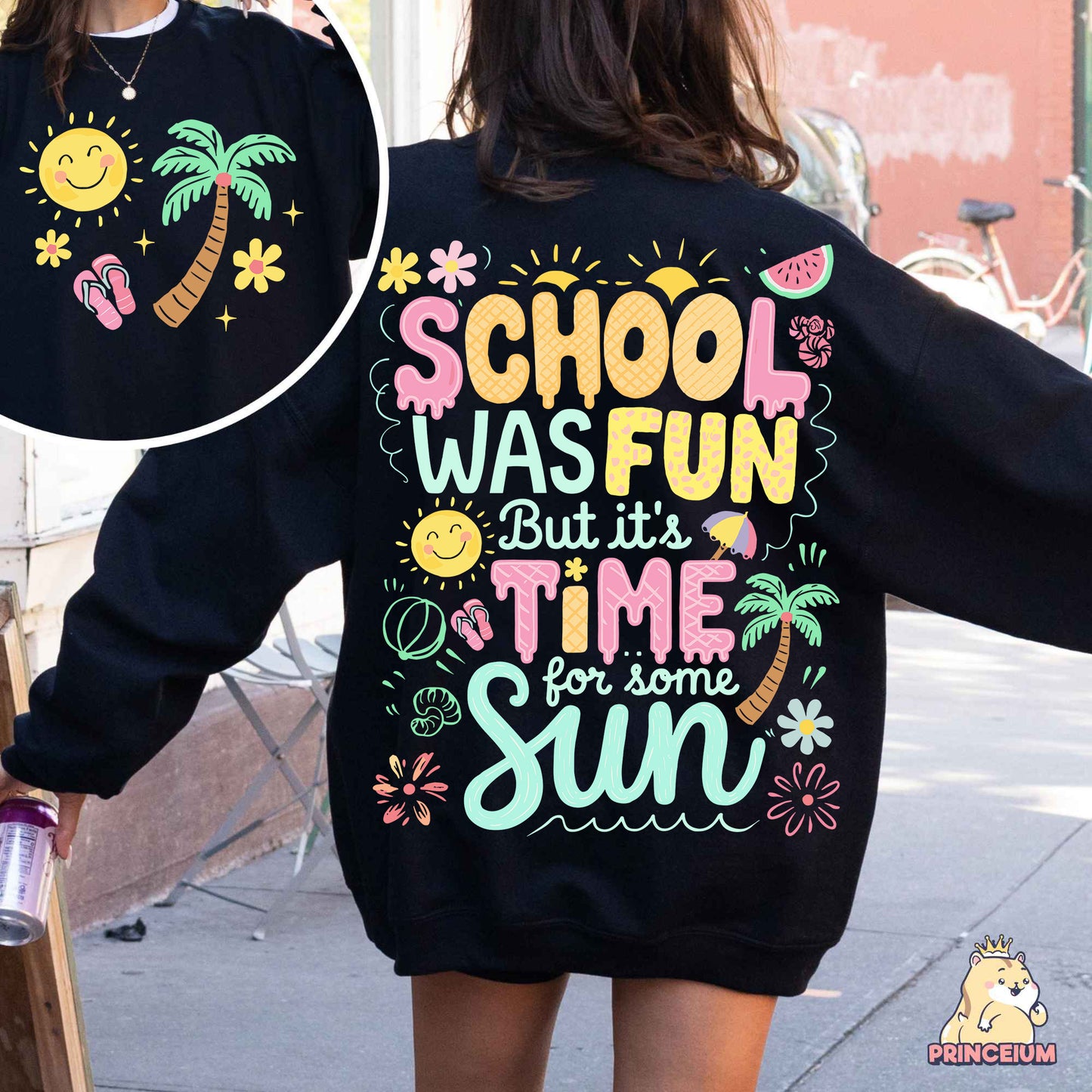 a woman walking down a street wearing a black sweatshirt