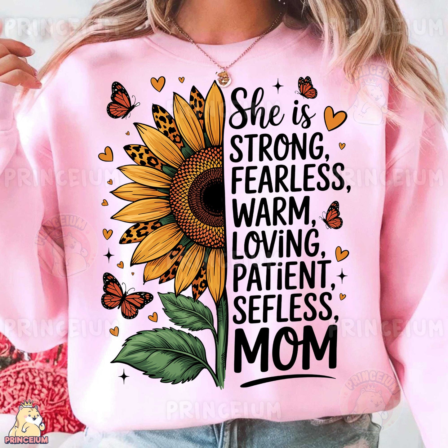 a woman wearing a pink sweatshirt with a sunflower and butterflies on it