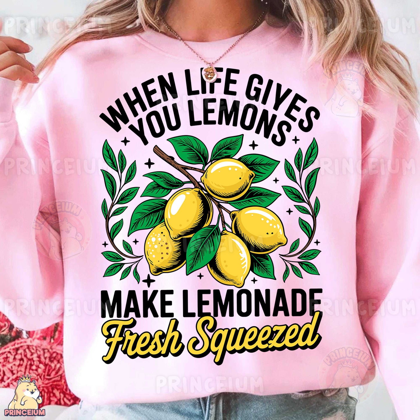 a woman wearing a pink sweatshirt with lemons on it