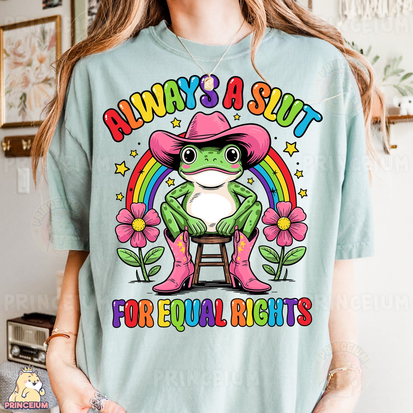 a woman wearing a t - shirt with a frog wearing a cowboy hat