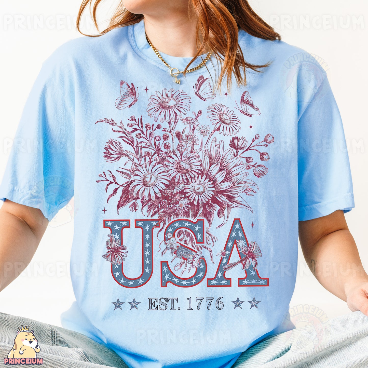 a woman in a blue usa t - shirt sitting on a bed