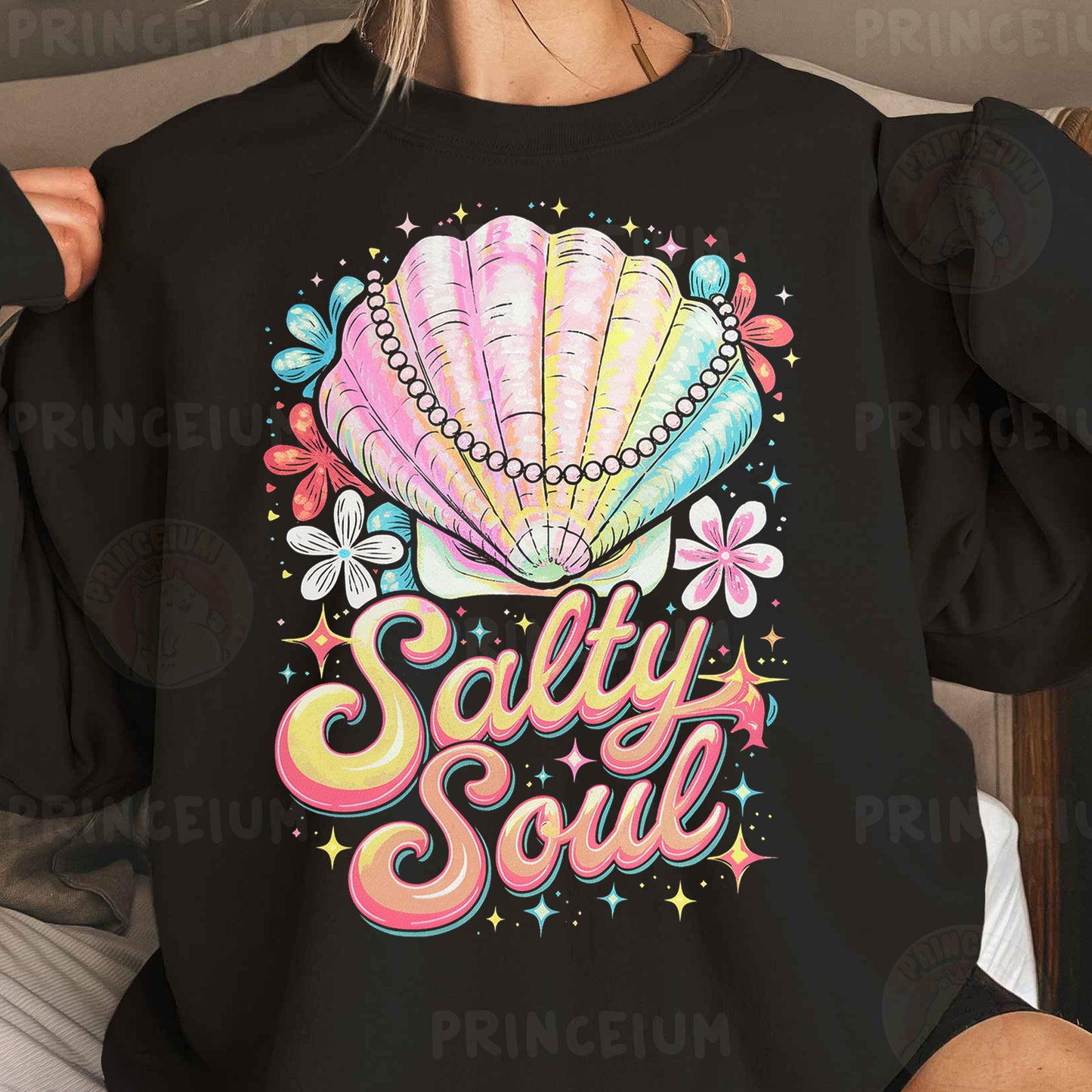 a woman wearing a black sweatshirt that says salty soul