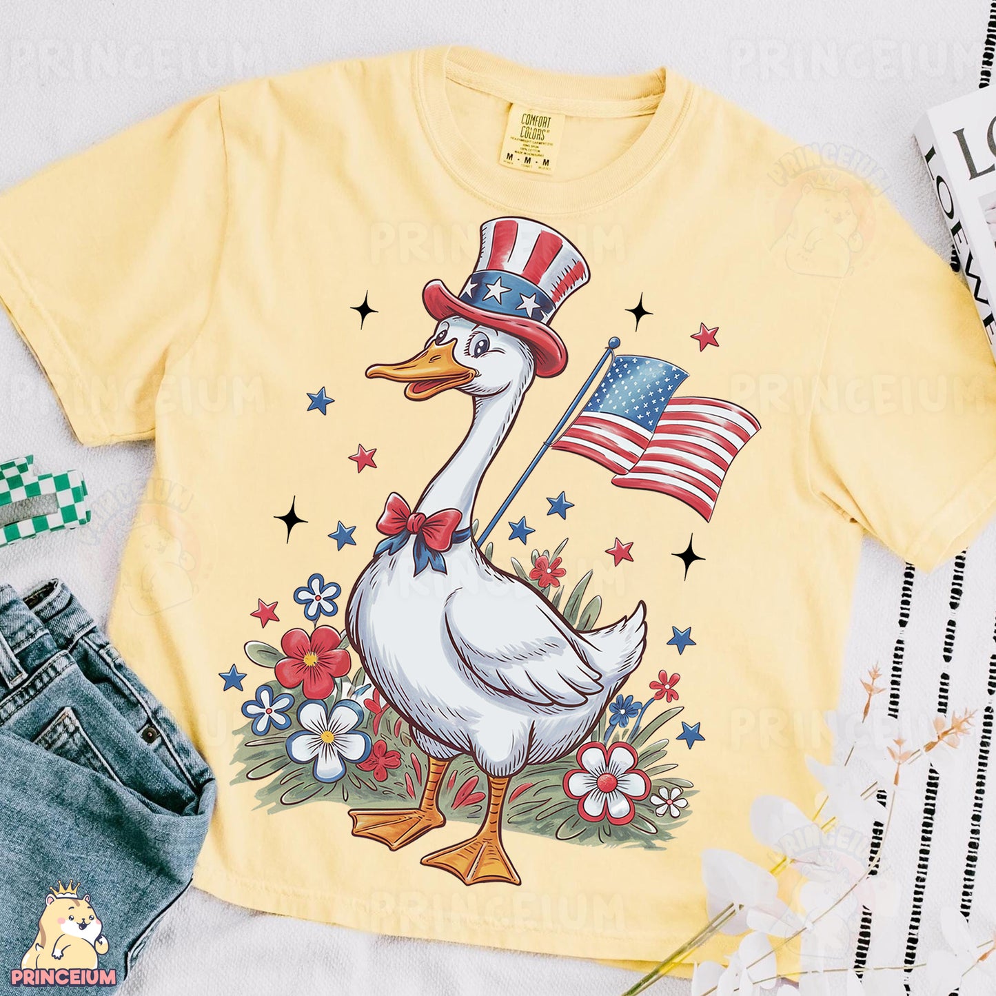 a yellow shirt with a duck wearing a hat and an american flag