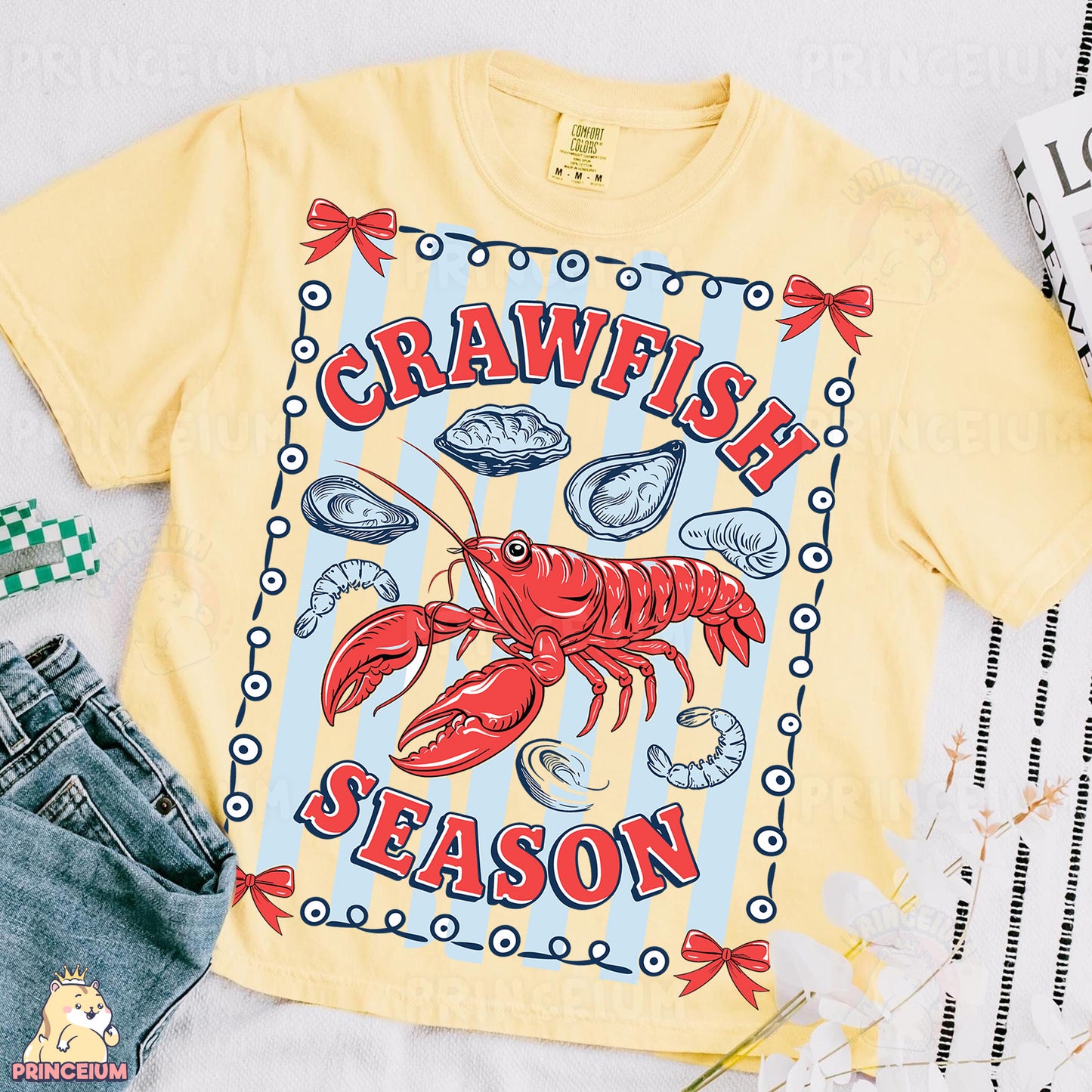 a yellow shirt with a lobster on it