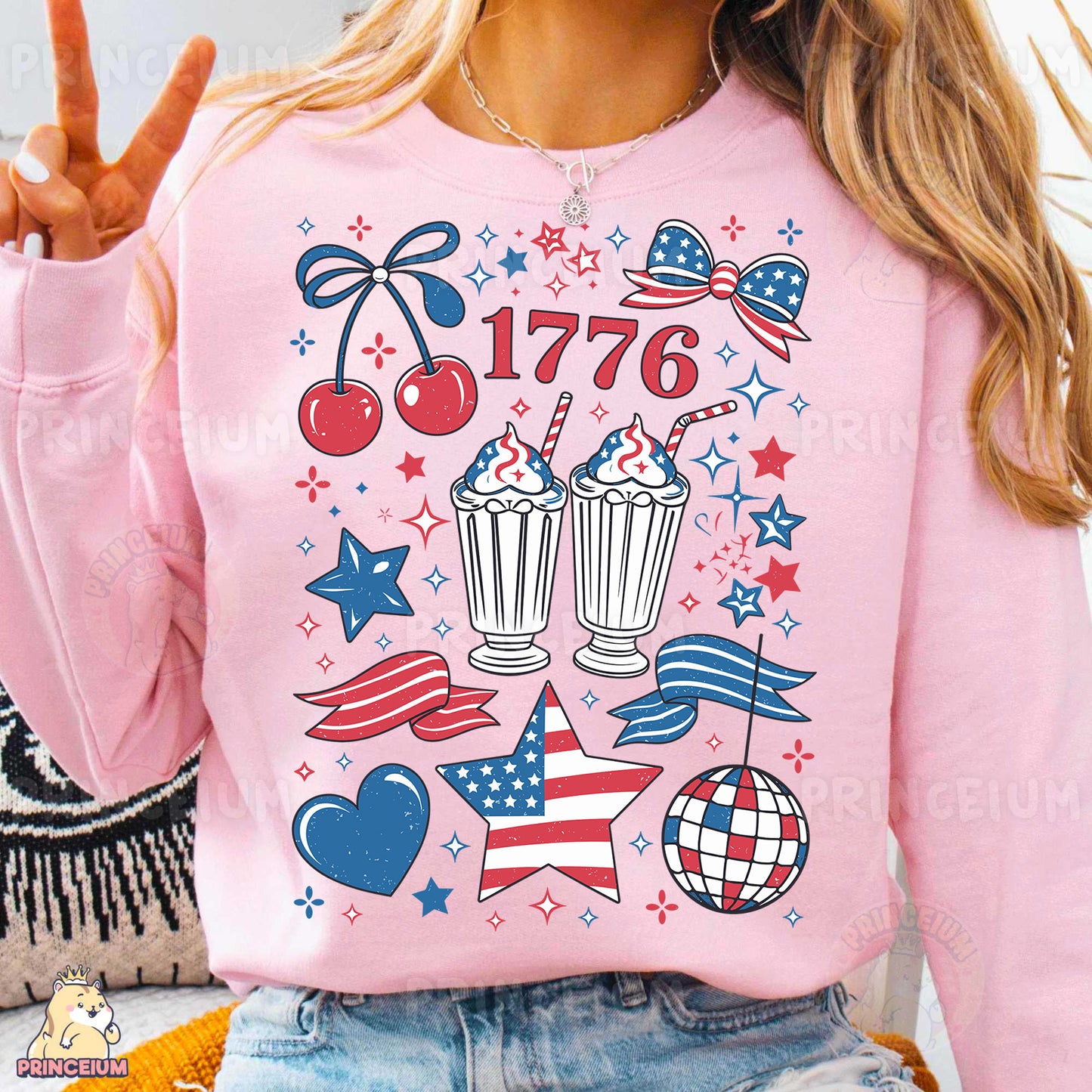 a woman wearing a pink sweatshirt with a patriotic design on it