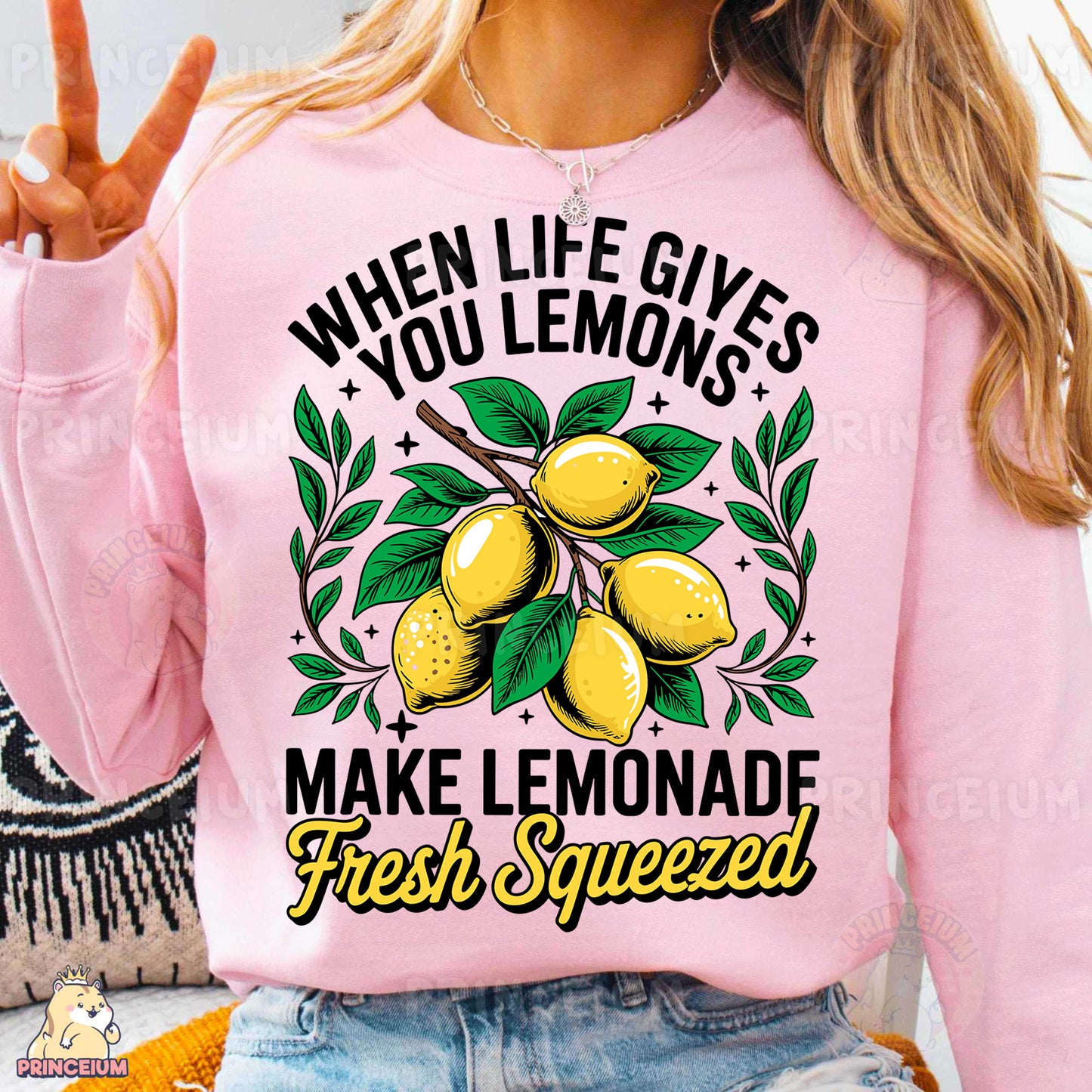 a woman wearing a pink sweatshirt that says when life gives you lemons make lemon