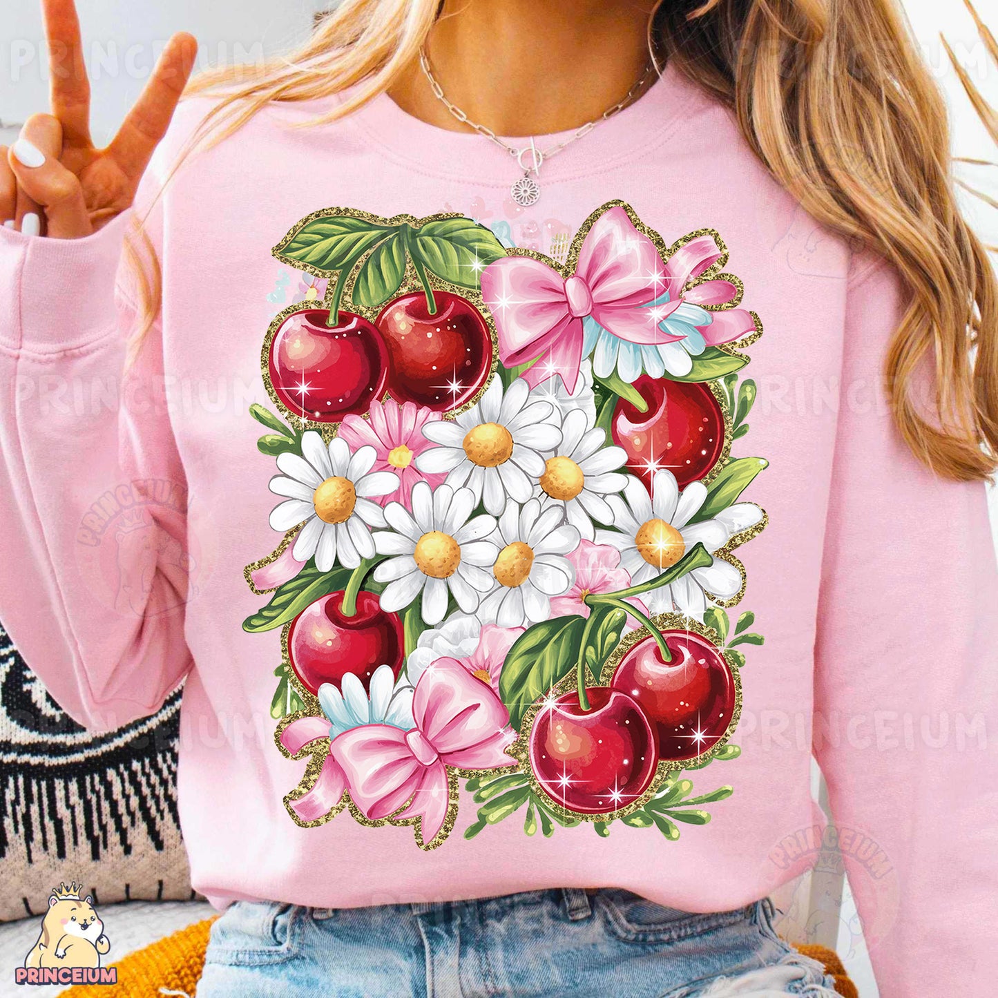 a woman wearing a pink sweatshirt with flowers and apples on it