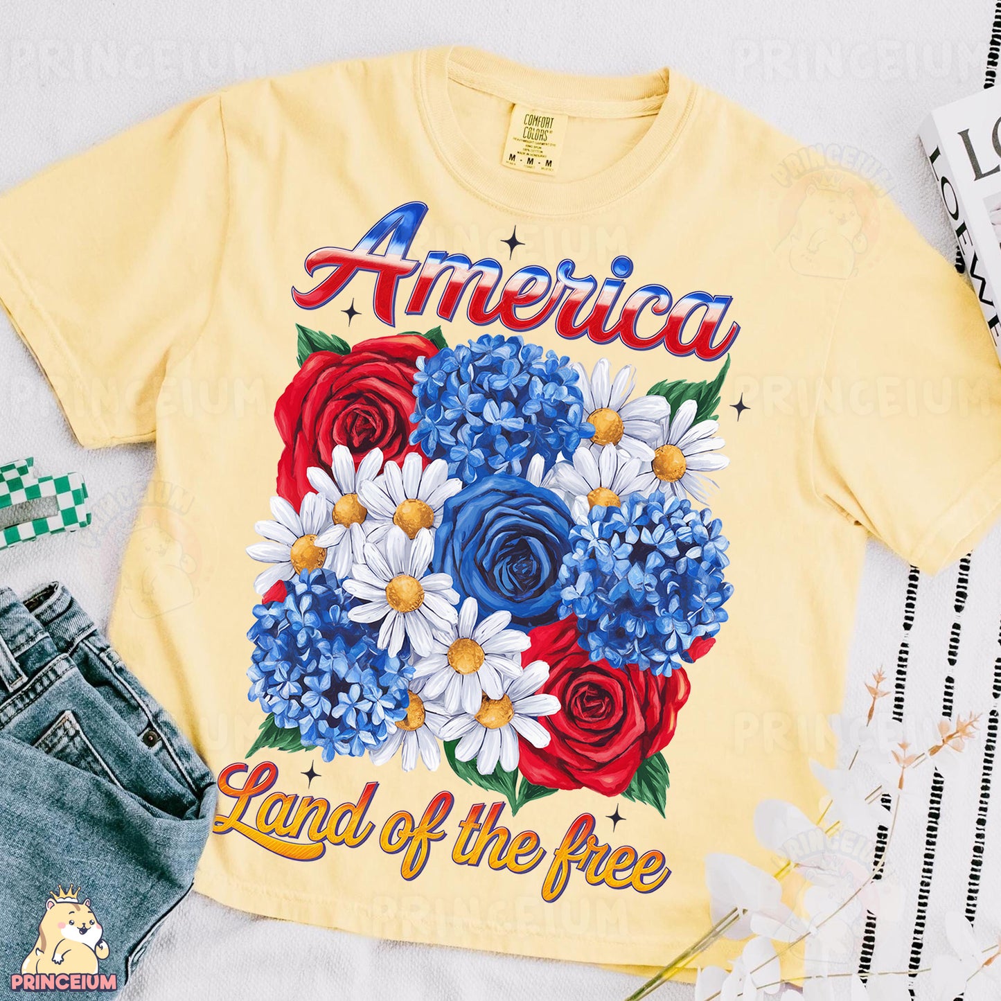 an american land of the free t - shirt next to a pair of jeans