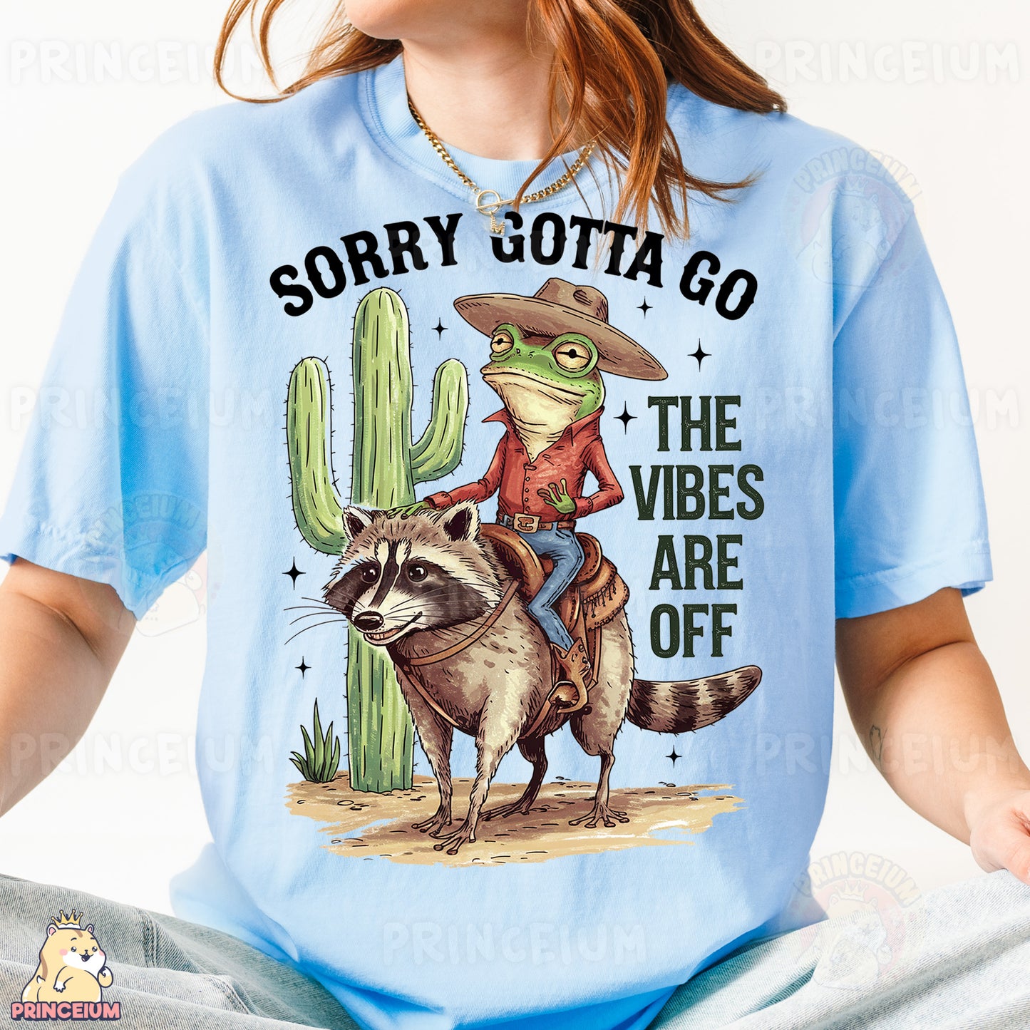a woman wearing a blue shirt with a racoon on it