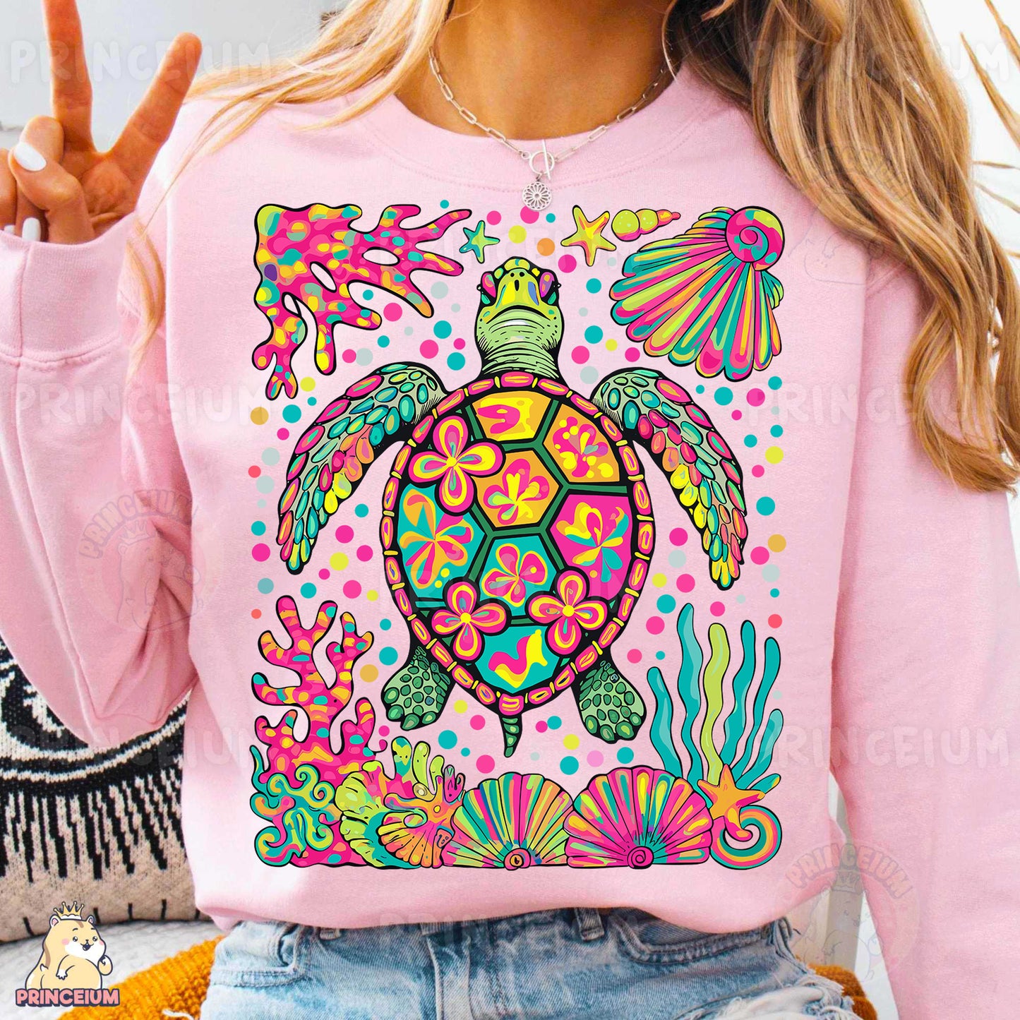 a woman wearing a pink turtle sweatshirt