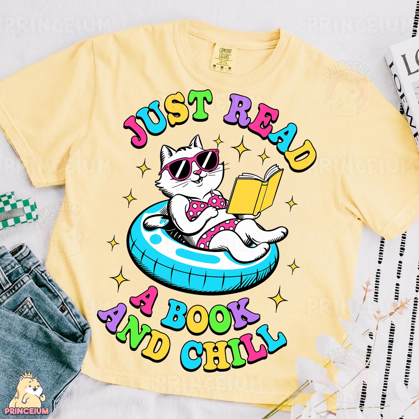 a t - shirt with a cat reading a book and wearing sunglasses