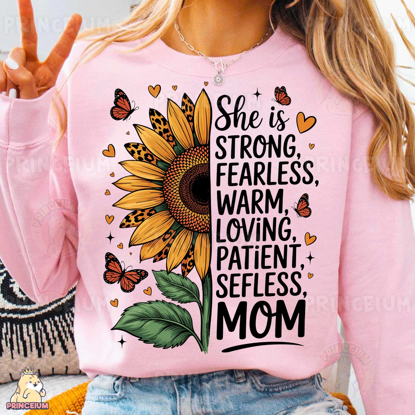 a woman wearing a pink shirt with a sunflower on it