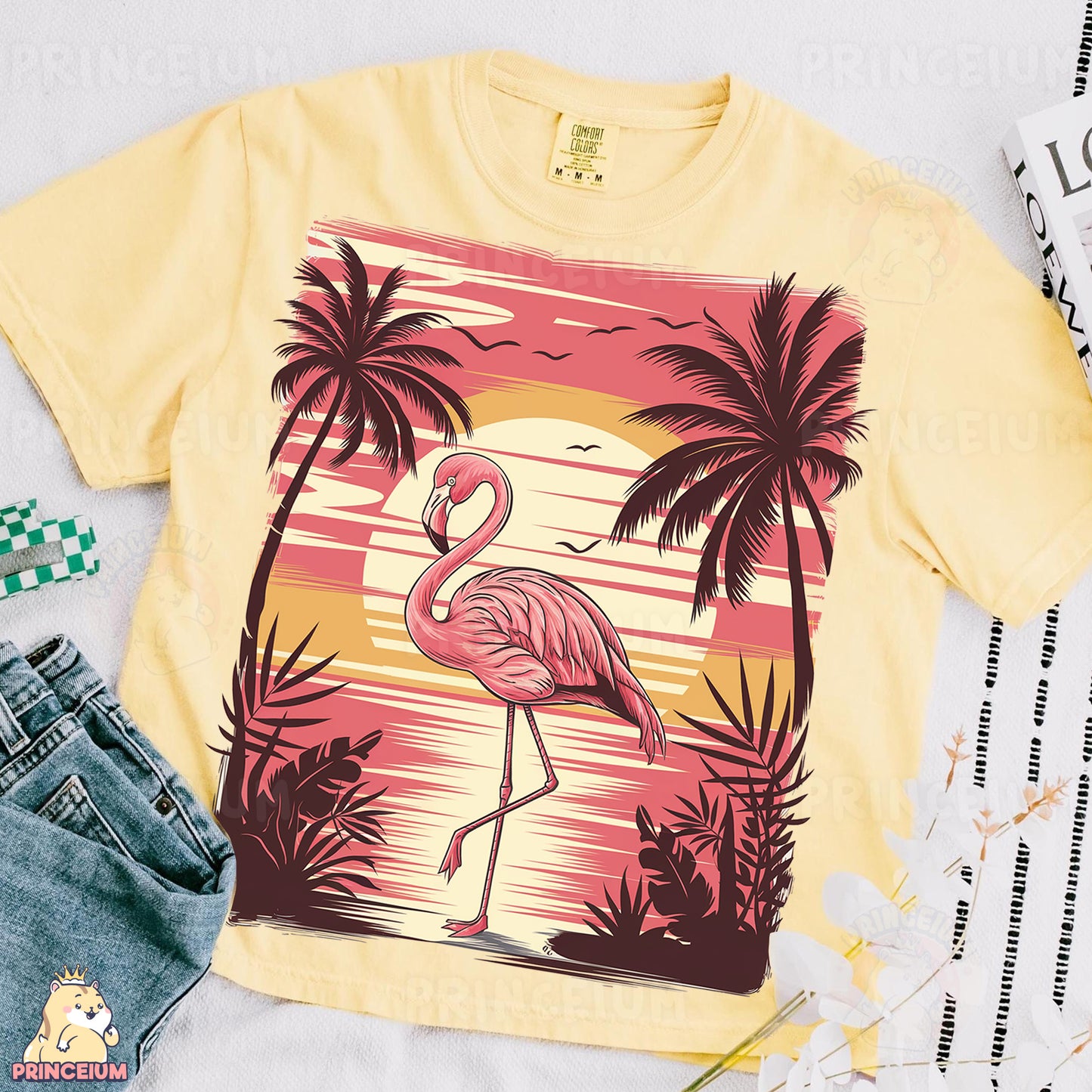 a yellow shirt with a pink flamingo on it