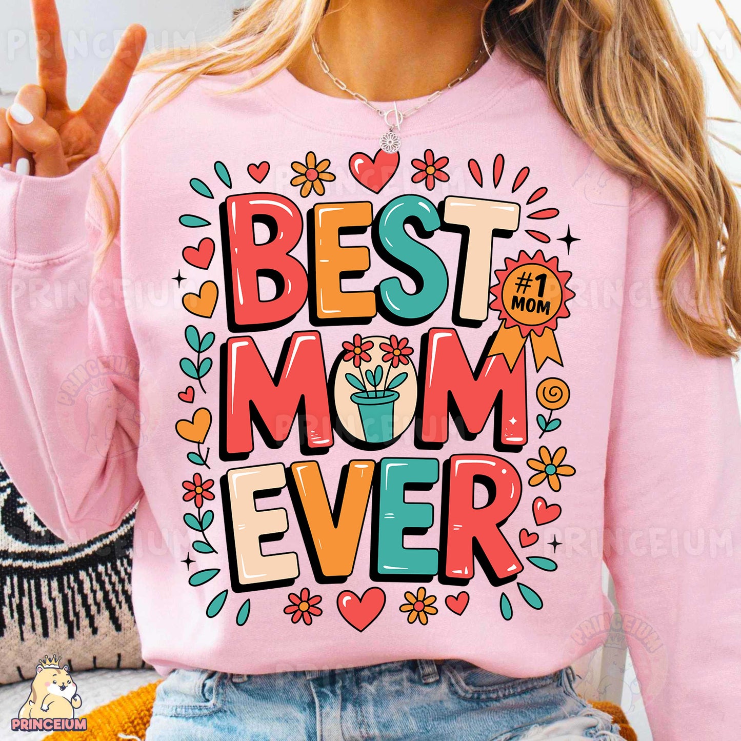 a woman wearing a pink sweatshirt with the words best mom ever on it