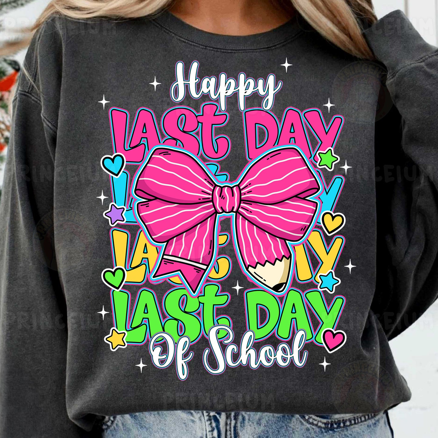 a woman wearing a black sweatshirt with a pink bow