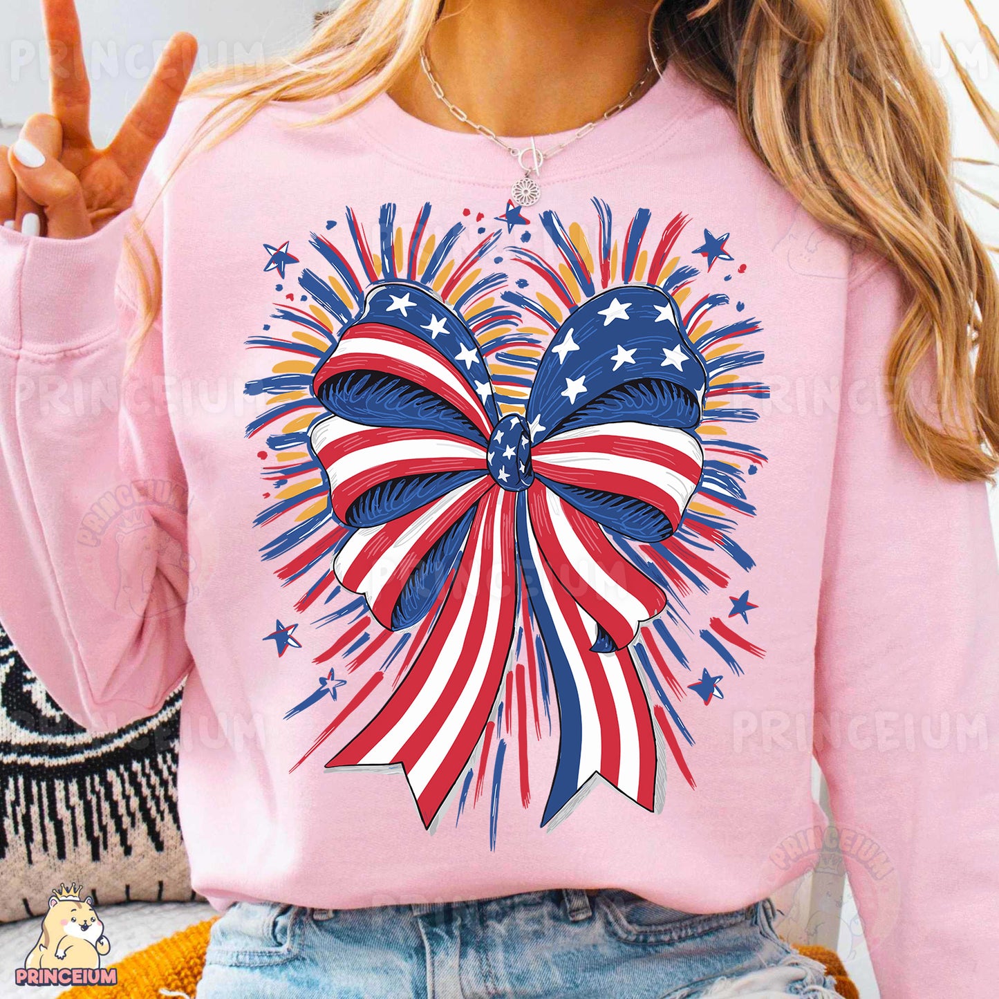 a woman wearing a pink sweater with a patriotic design on it