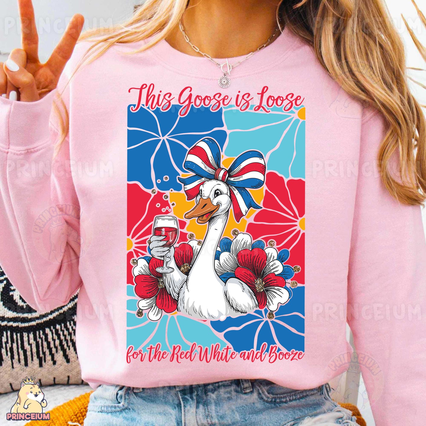 a woman wearing a pink shirt with a goose on it