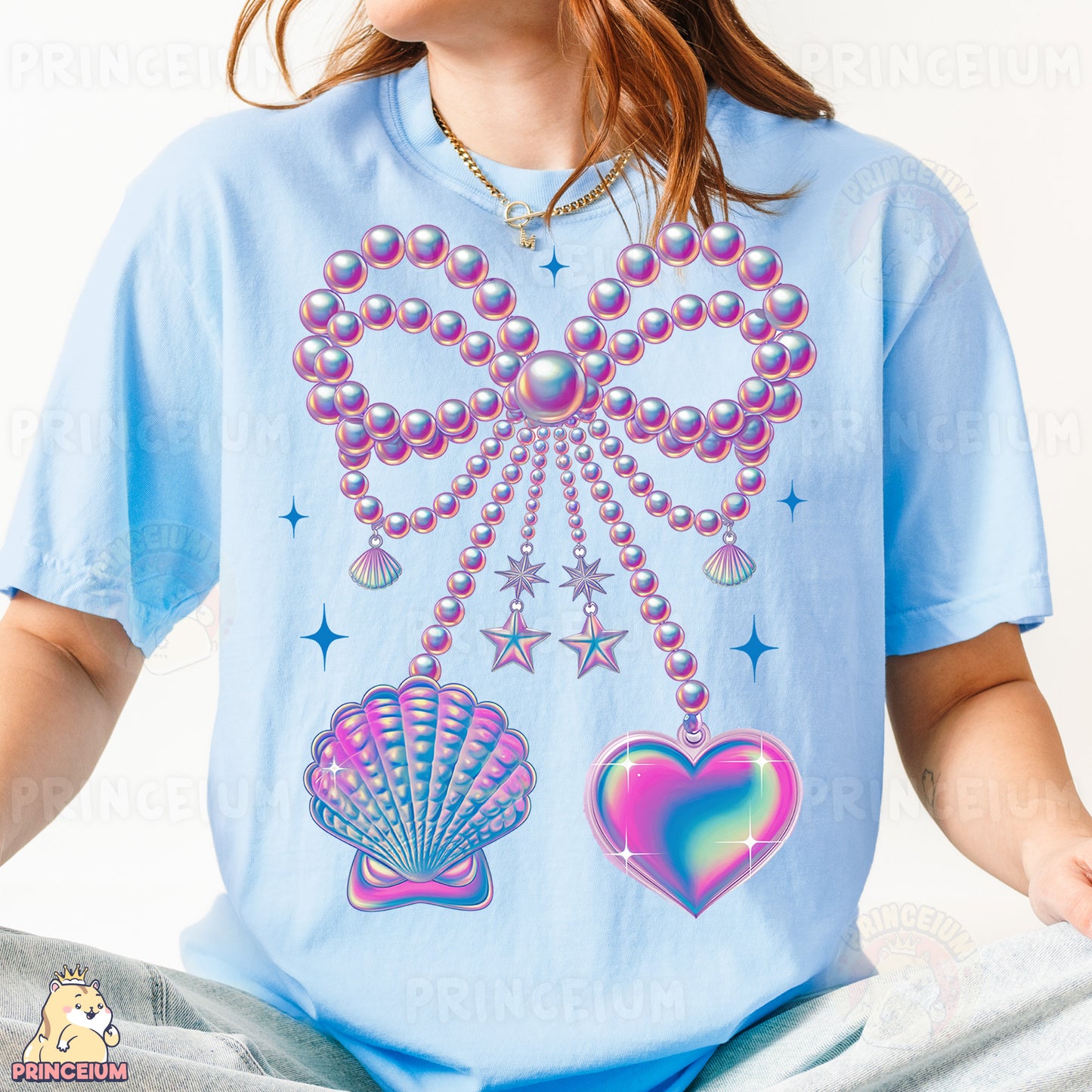 a woman wearing a t - shirt with a design of pearls and seashells