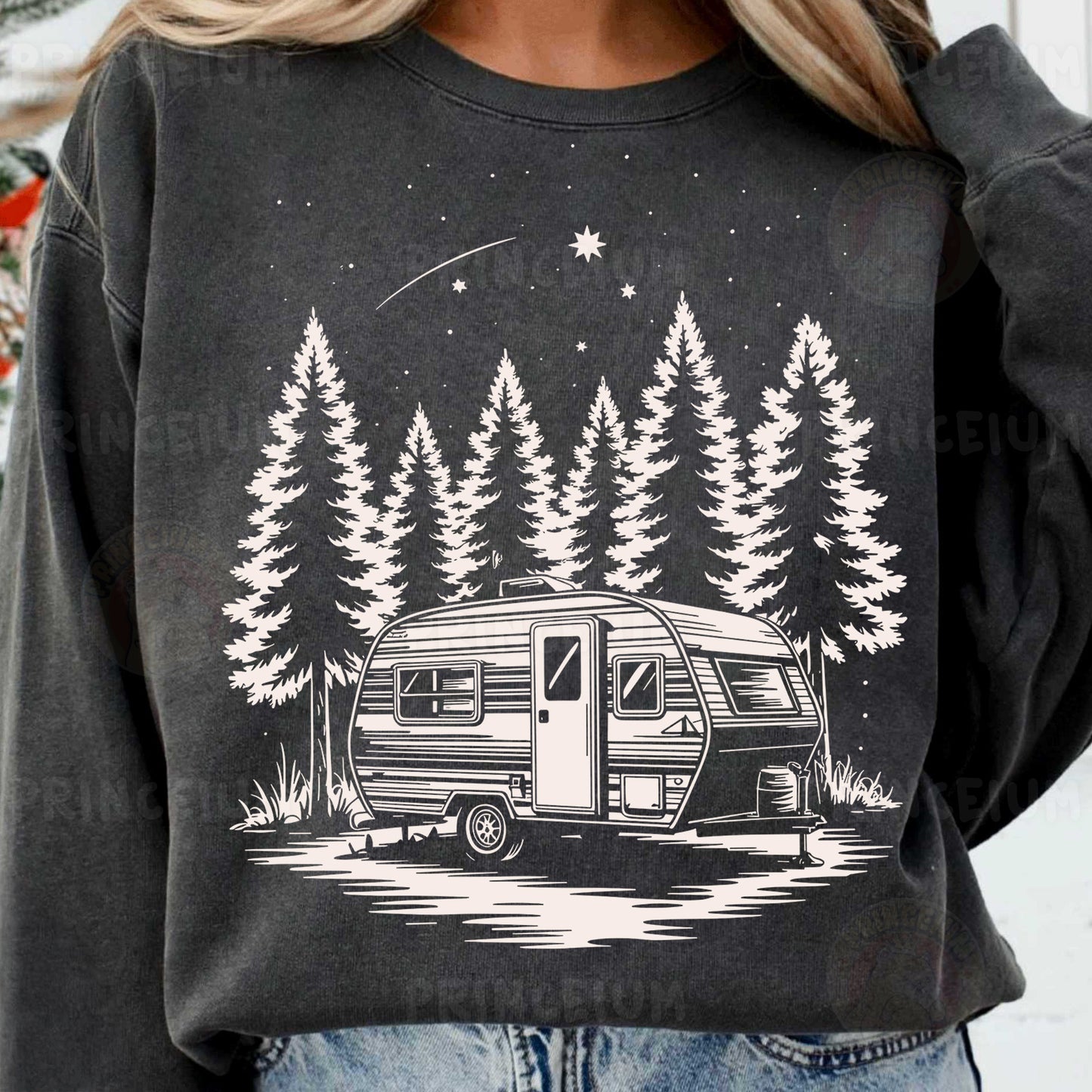 a woman wearing a sweatshirt with a camper on it