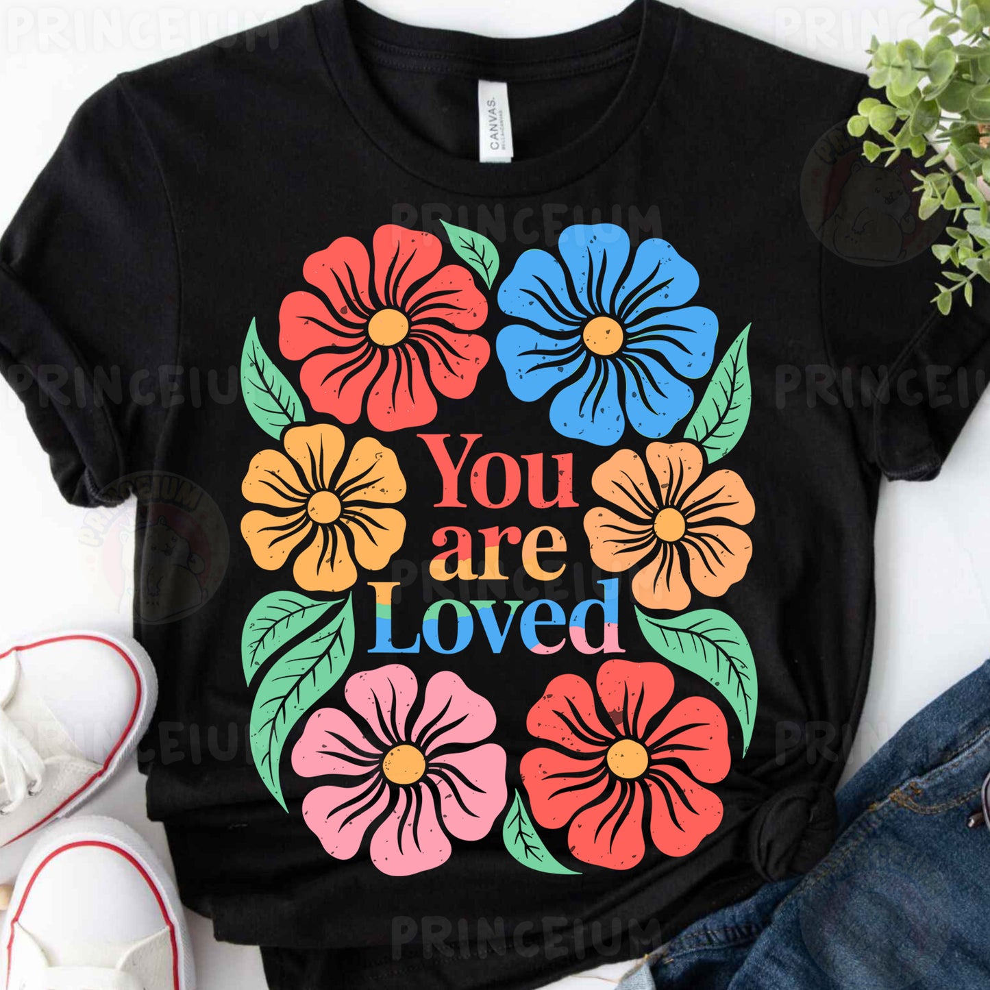 a t - shirt that says you are loved surrounded by flowers