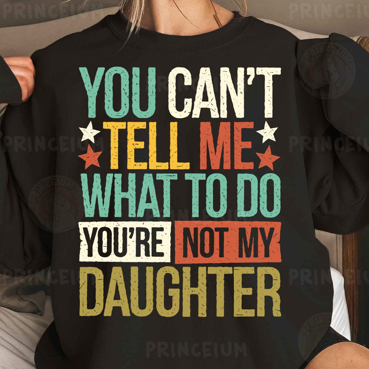 a woman wearing a black sweatshirt that says you can't tell me what to