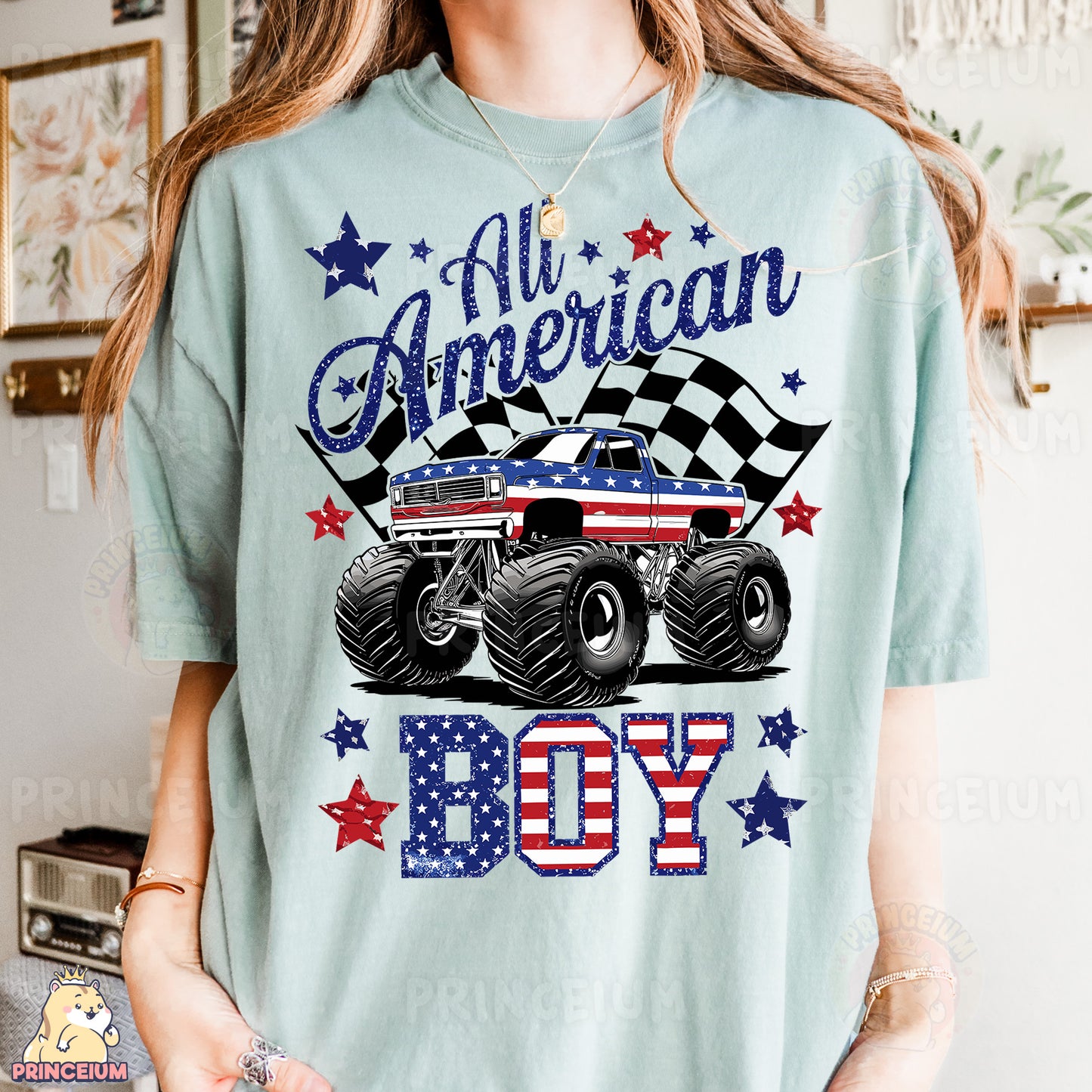 a woman wearing a blue shirt with a monster truck on it