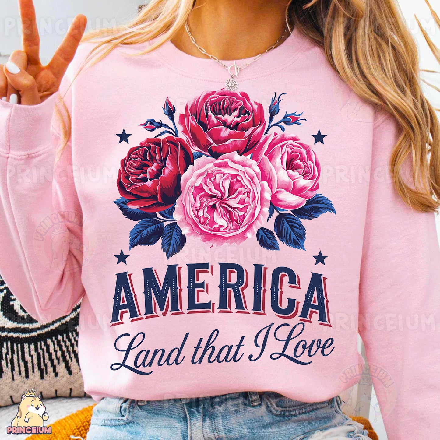 a woman wearing a pink america land that i love sweatshirt