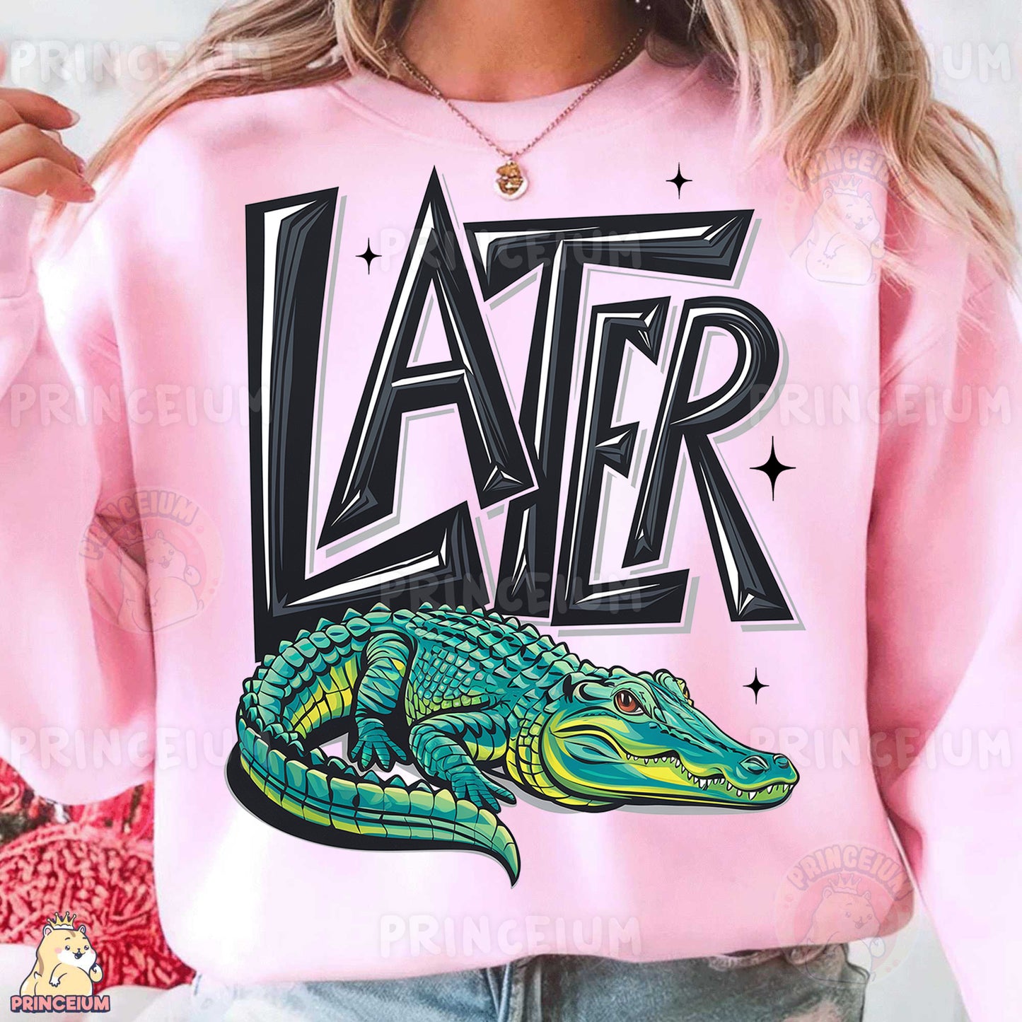 a woman wearing a pink sweater with an alligator on it
