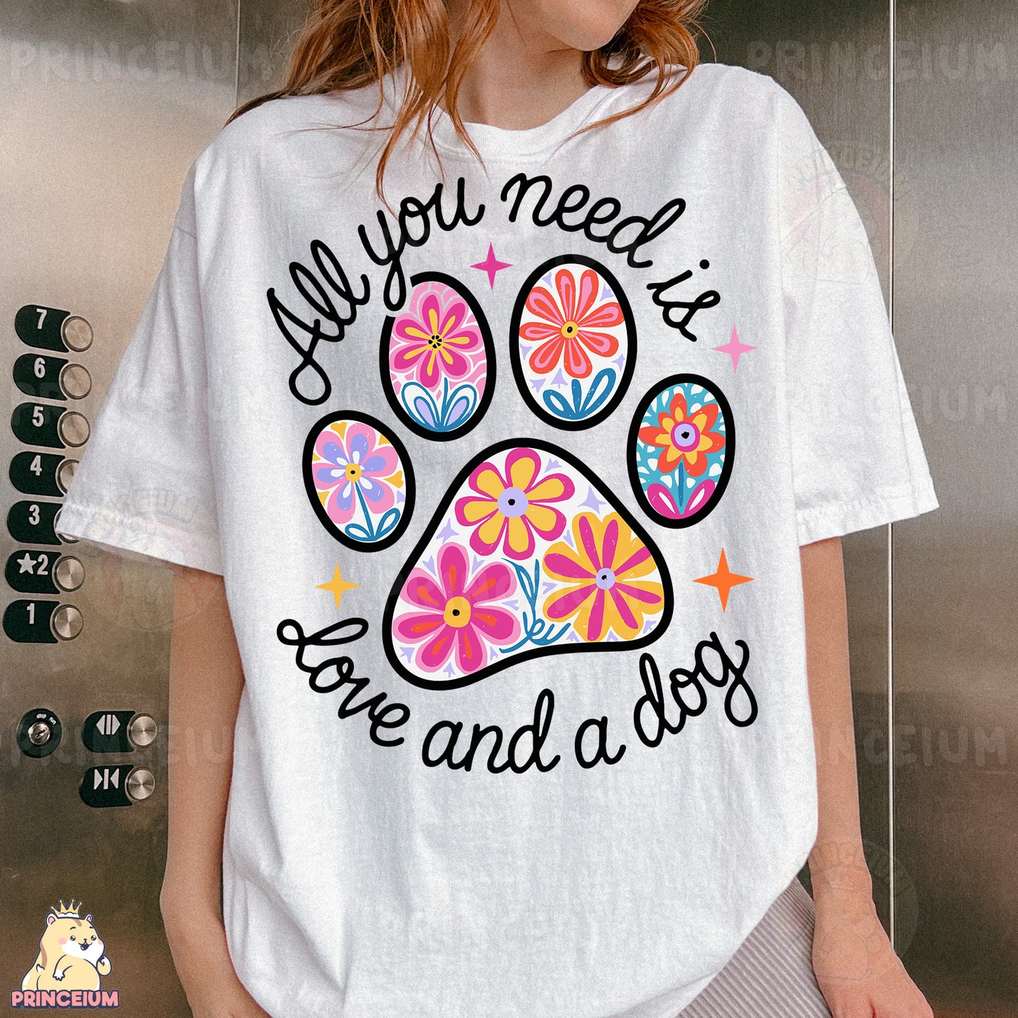 a woman wearing a t - shirt with a dog paw on it