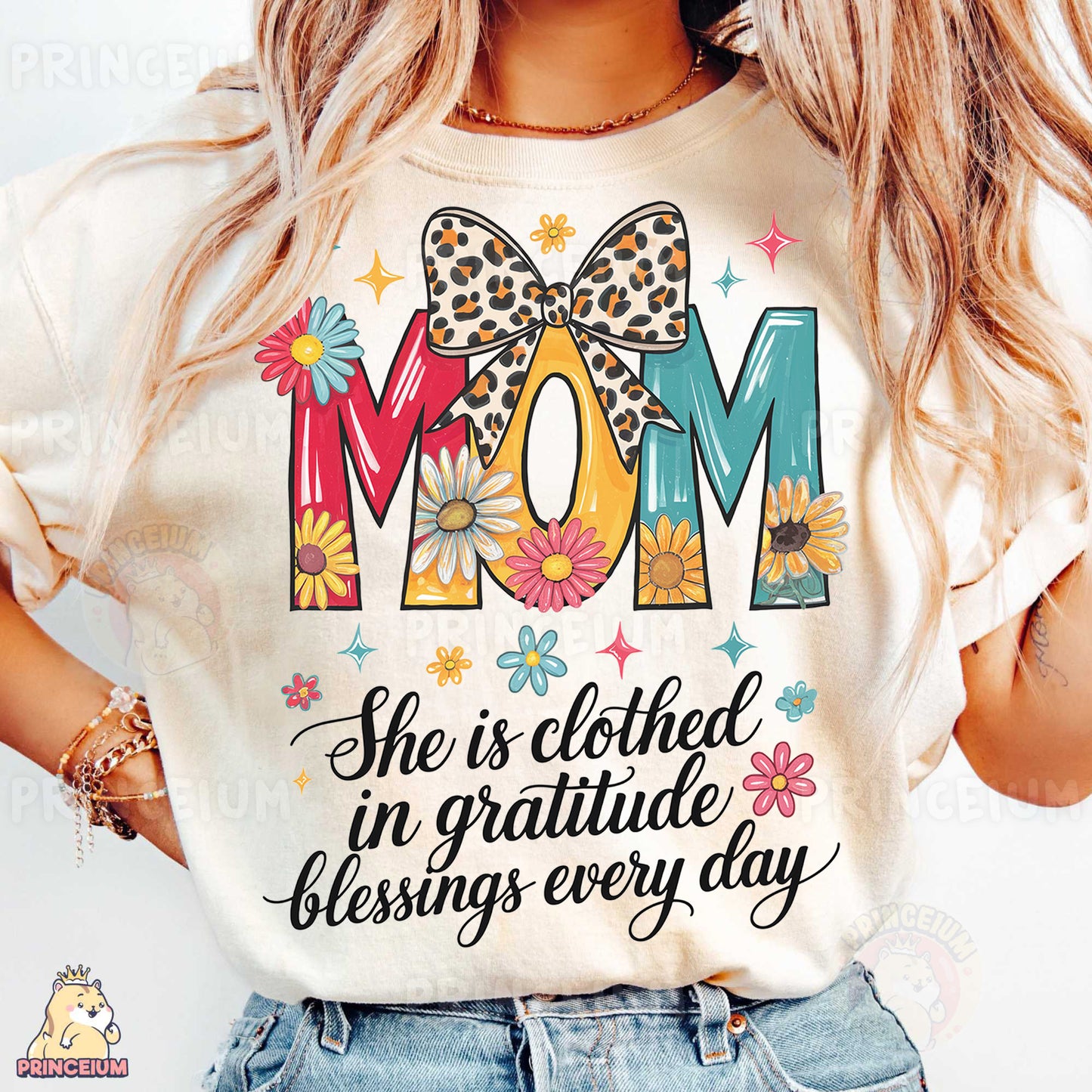 a woman wearing a t - shirt that says mom she is clothed in grati