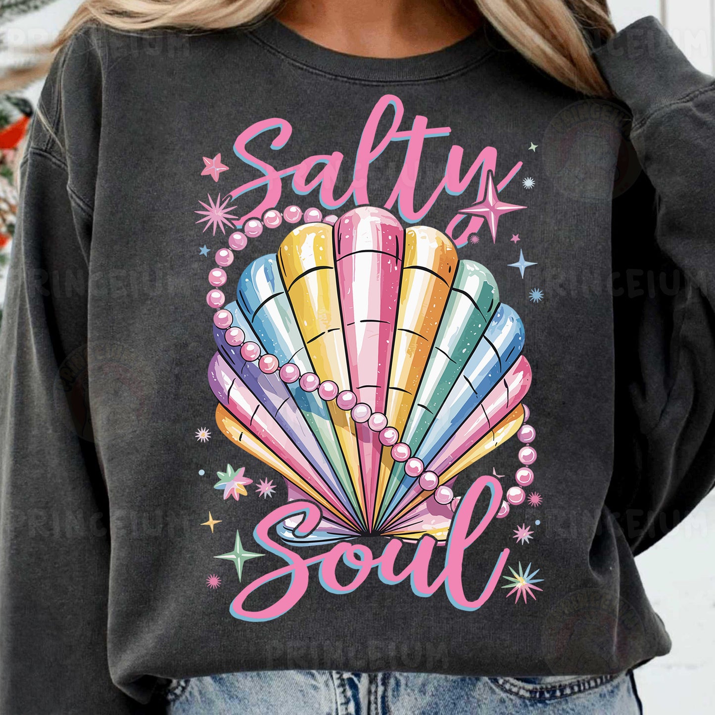 a woman wearing a sweatshirt that says salty soul