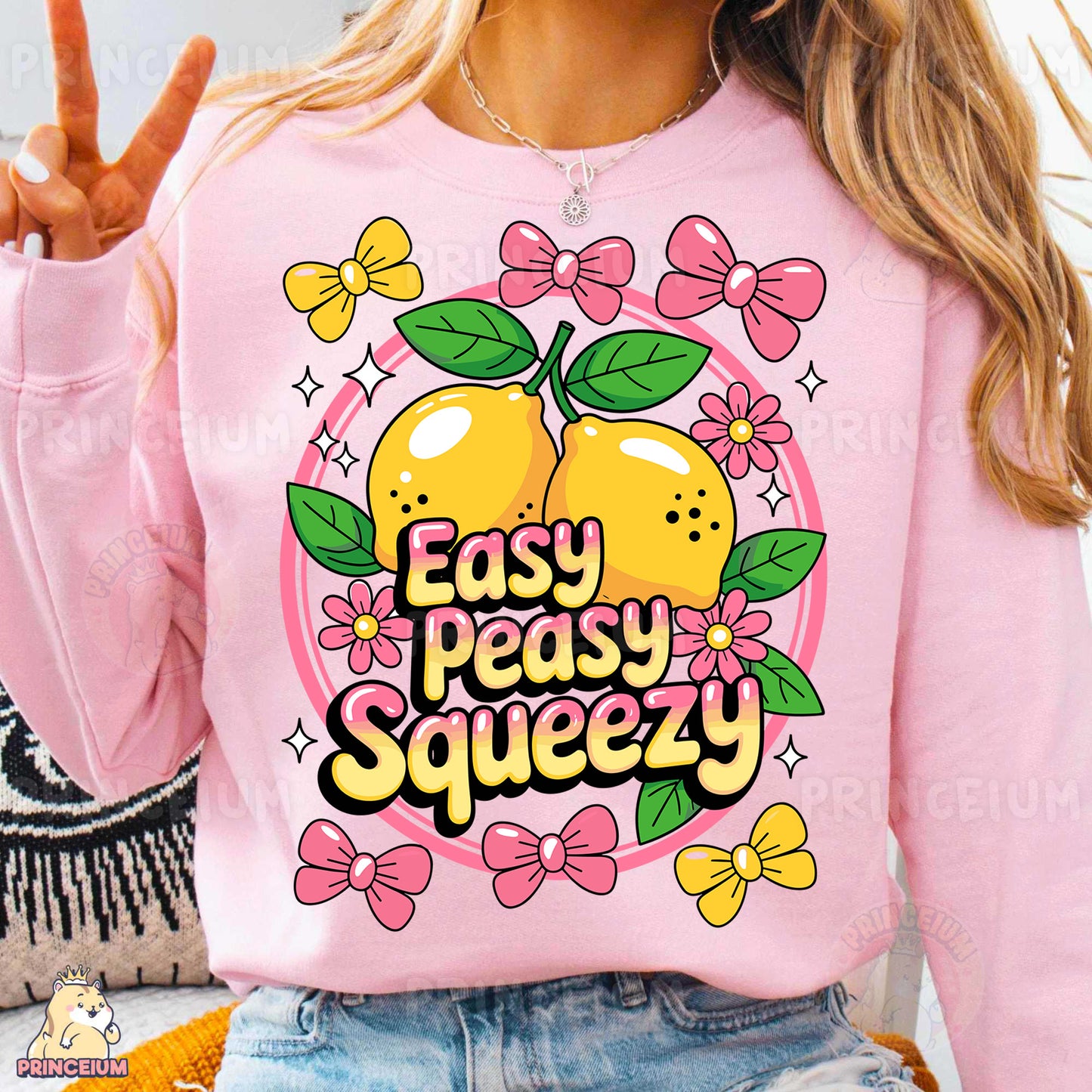 a woman wearing a pink sweatshirt that says easy peasy squeezey