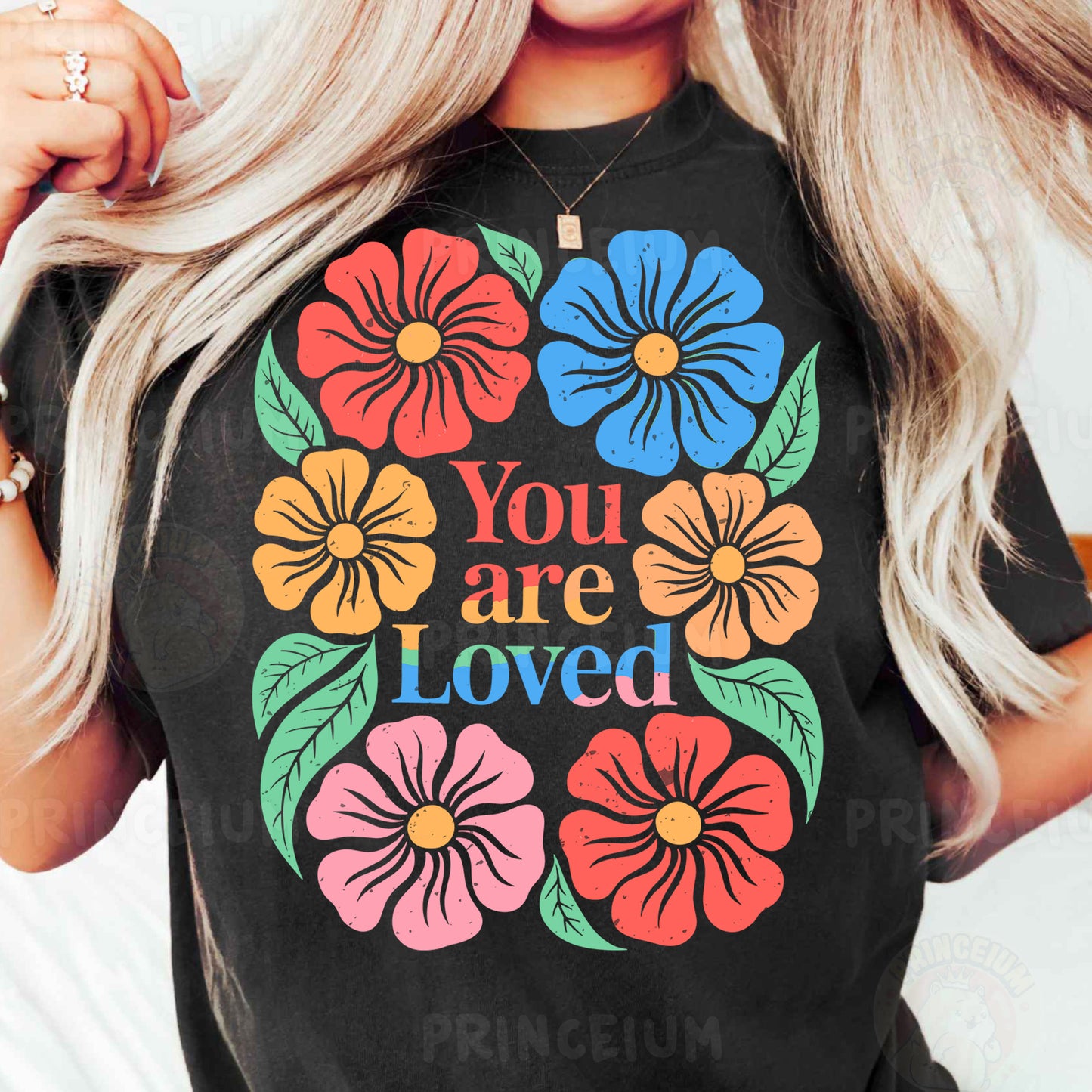 a woman wearing a t - shirt that says you are loved