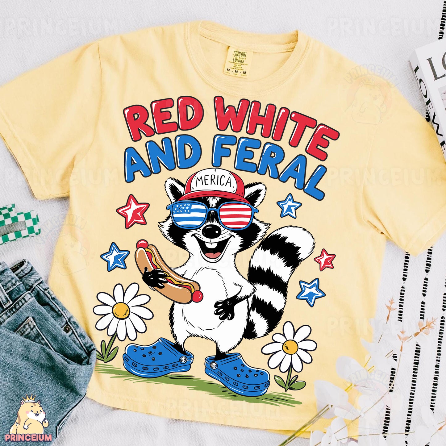 a yellow shirt with a raccoon wearing a red white and blue hat and