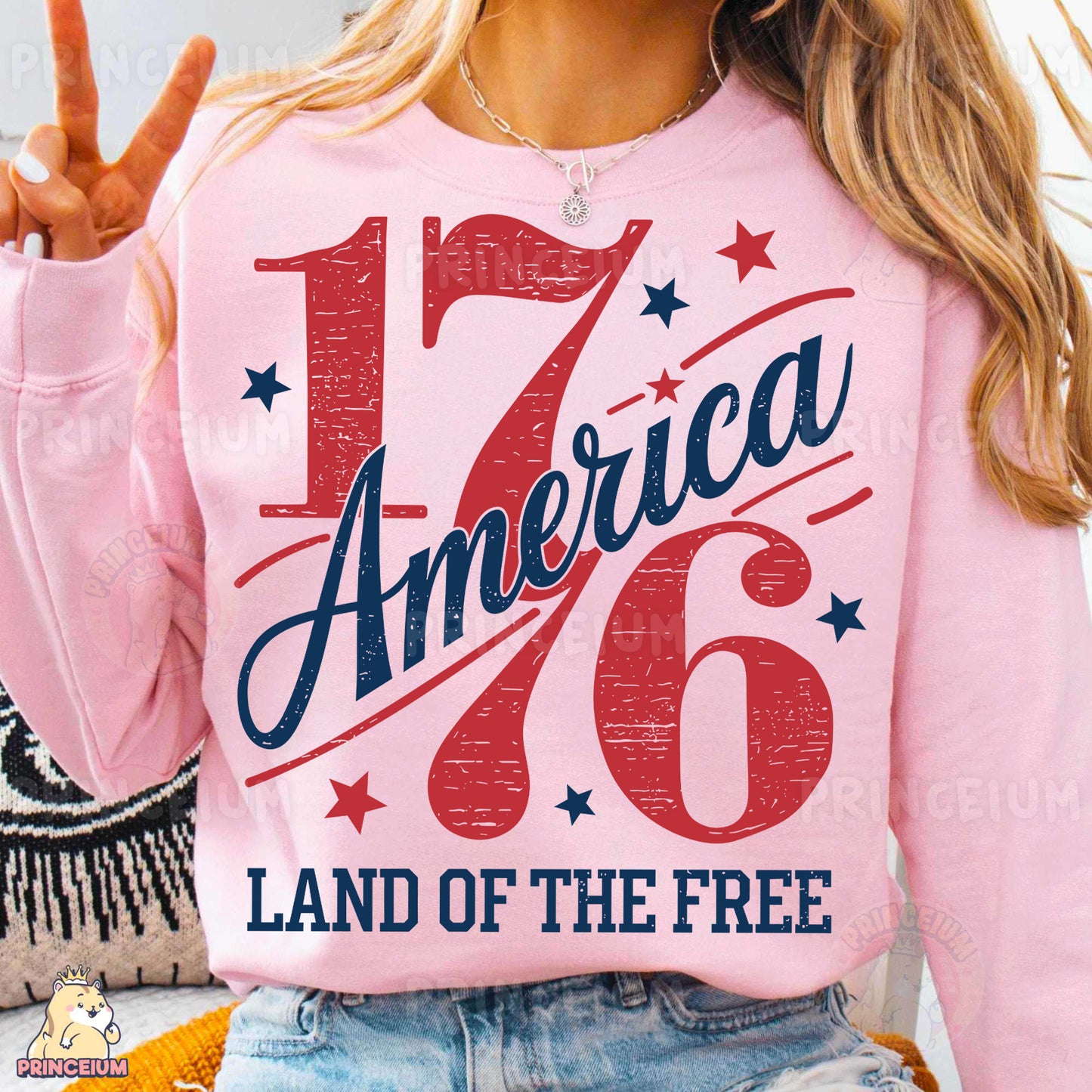 a woman wearing a pink sweatshirt that says america 76 land of the free