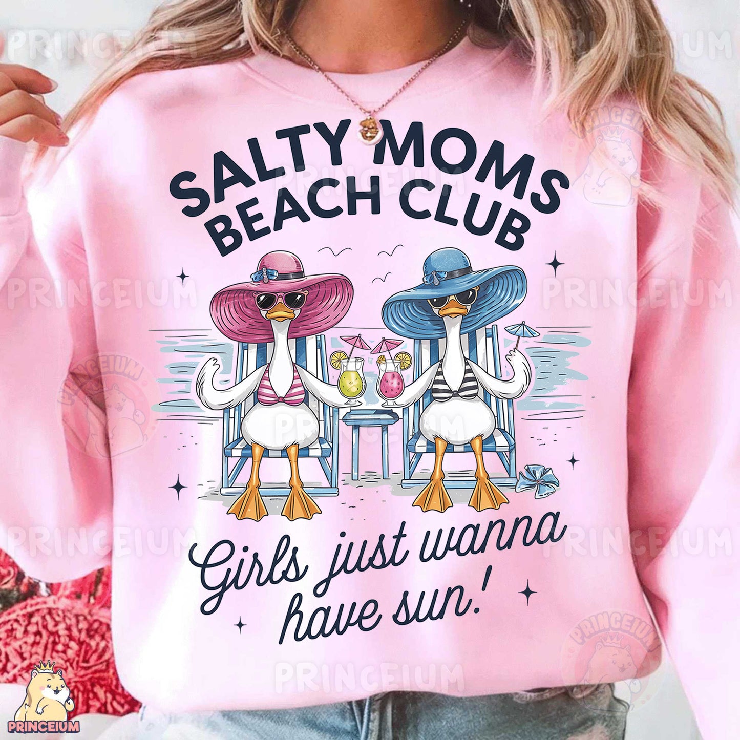 a woman wearing a pink sweatshirt that says salty moms beach club