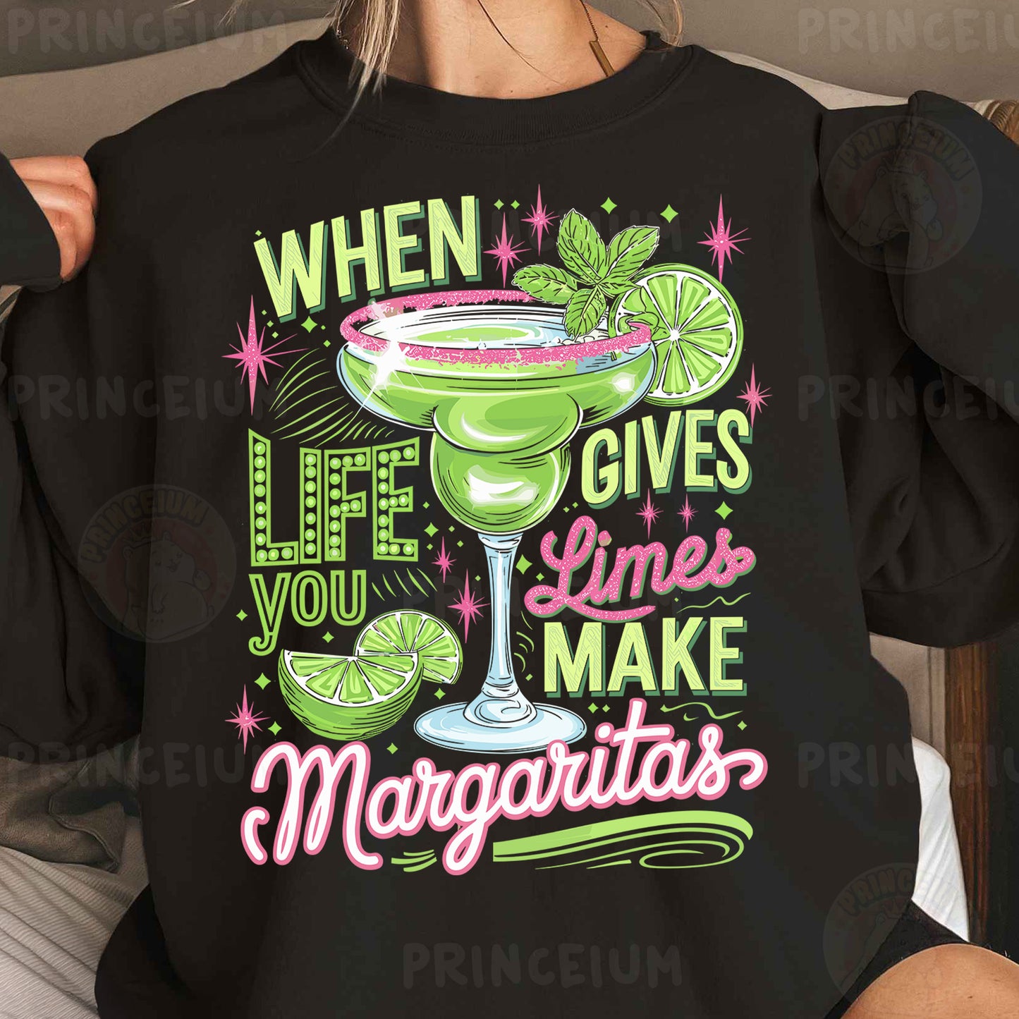 a woman wearing a black sweatshirt that says when life gives limes make margaritas