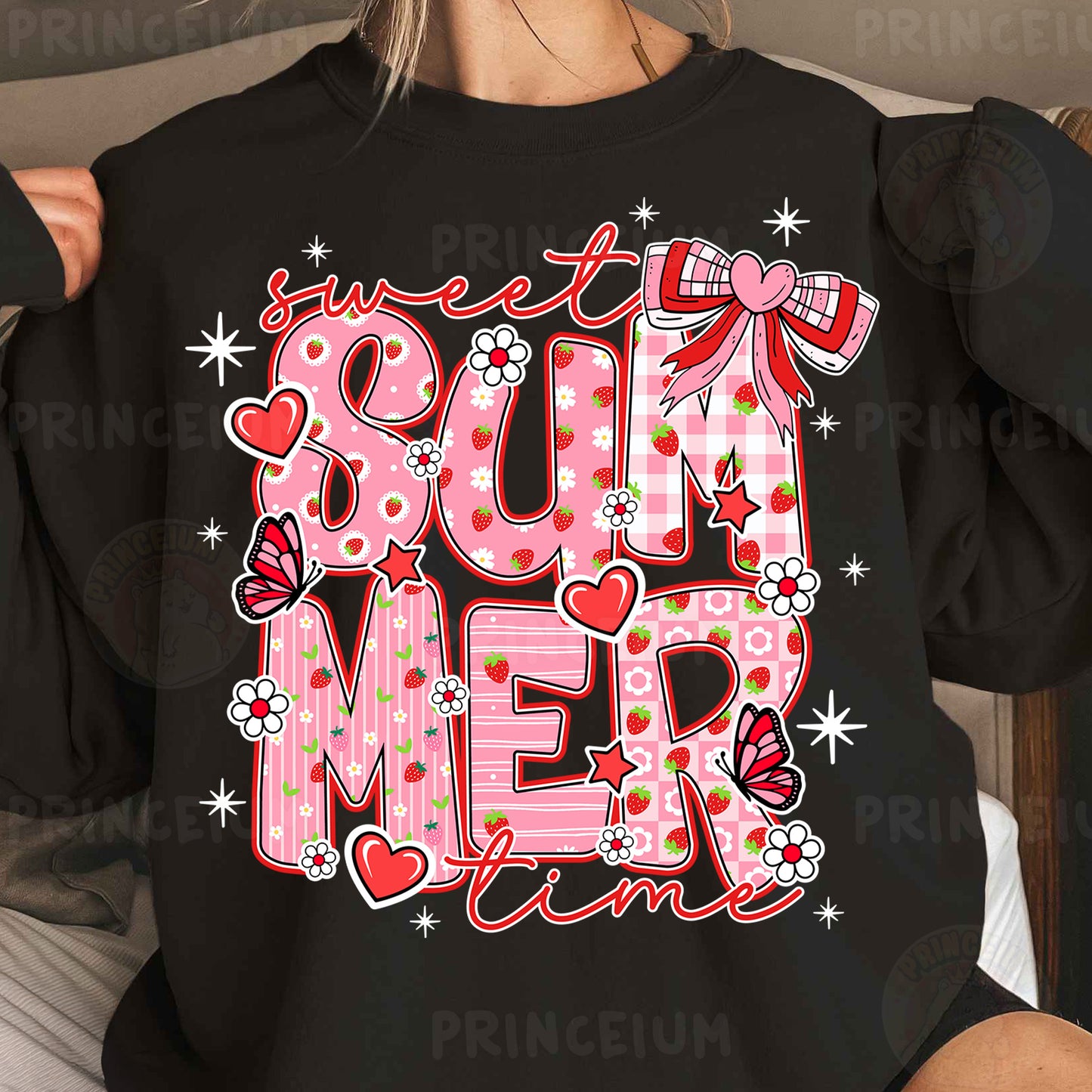 a woman wearing a black shirt with a pink and red design