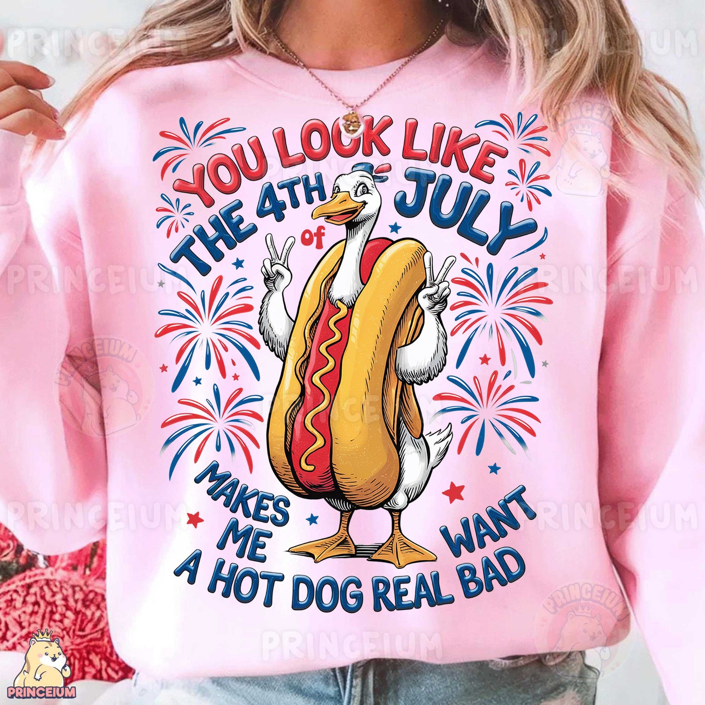 a woman wearing a pink sweatshirt with a hot dog on it
