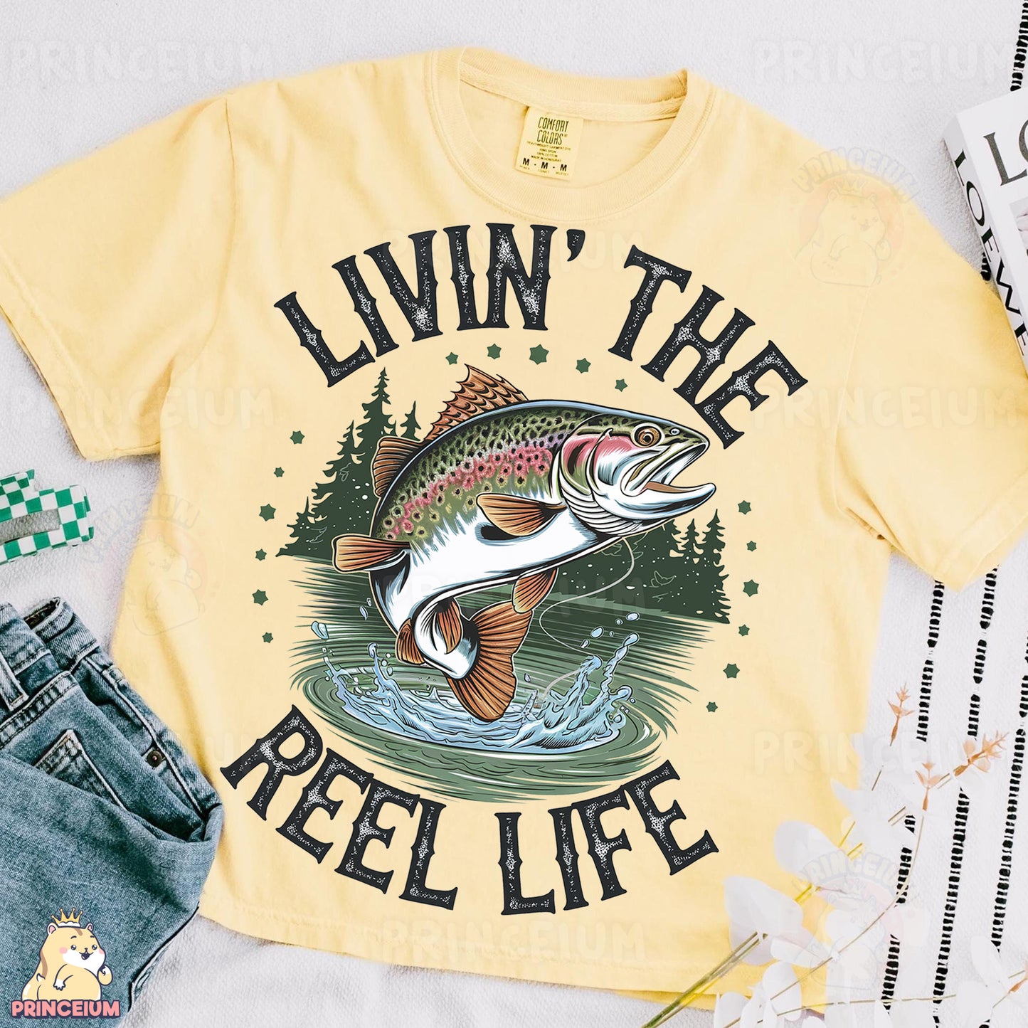 a t - shirt that says livin'the reel life with a fish on