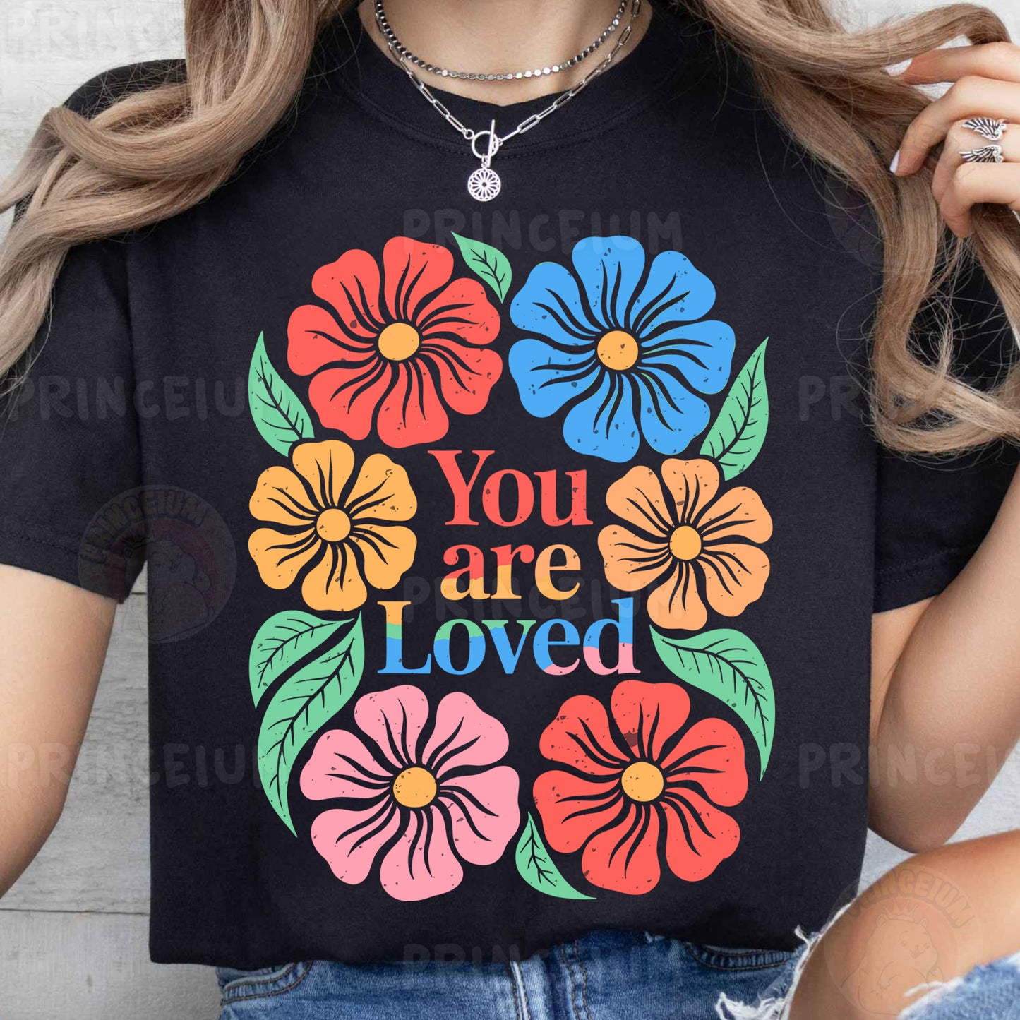 a woman wearing a t - shirt that says you are loved