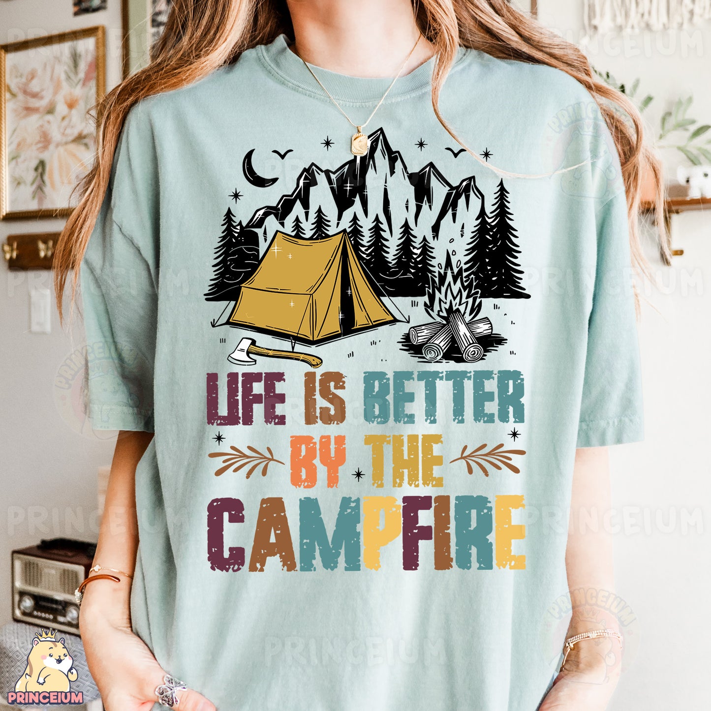 a woman wearing a t - shirt that says life is better by the campfire