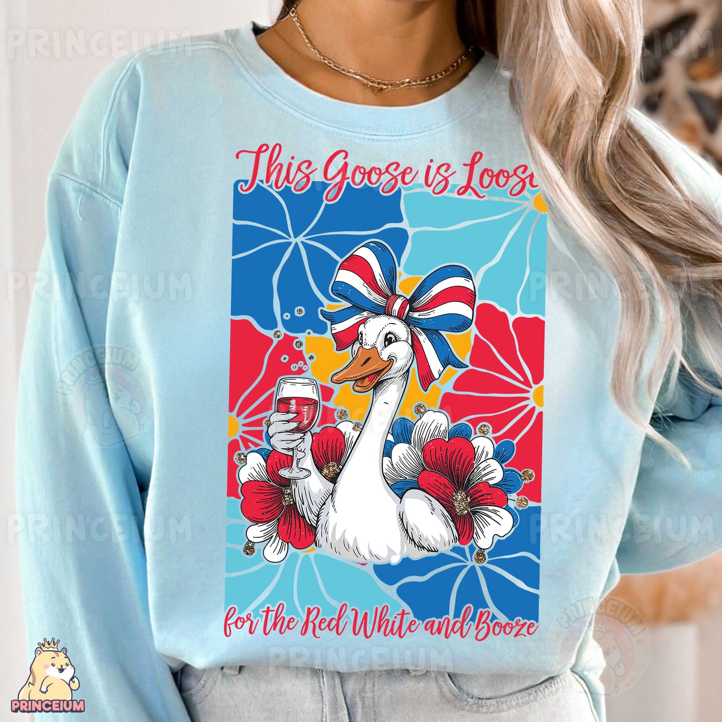 a woman wearing a blue sweatshirt with a goose on it