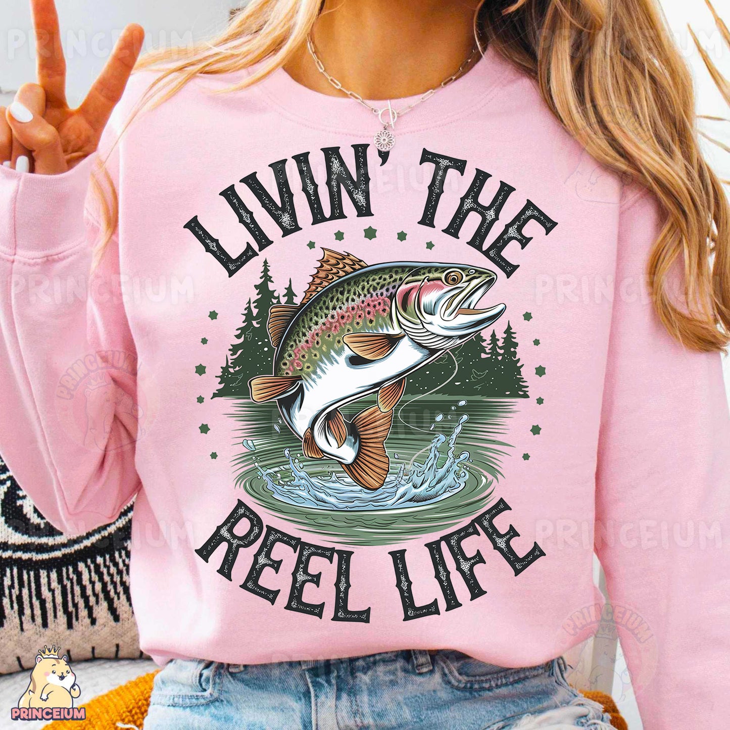 a woman wearing a pink shirt that says livn the reel life