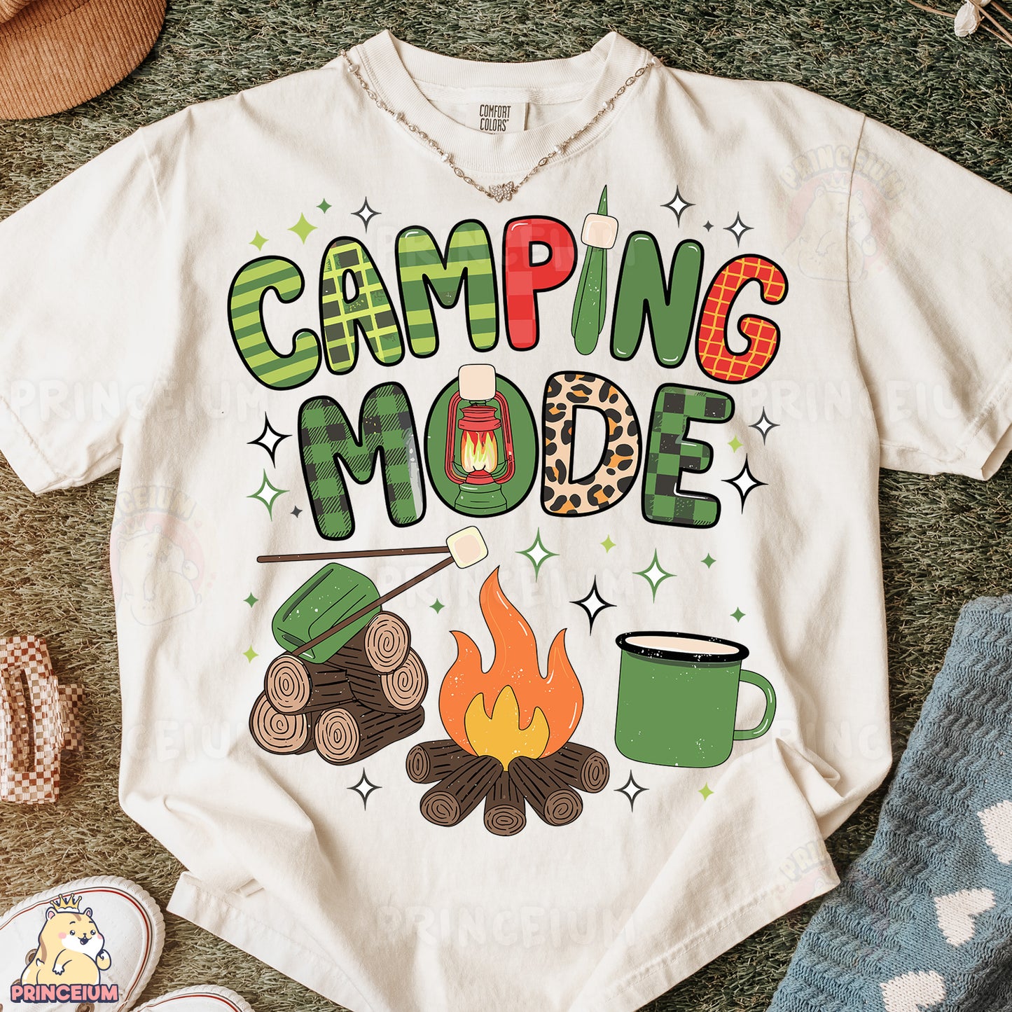 a t - shirt that says camping mode next to a pair of shoes