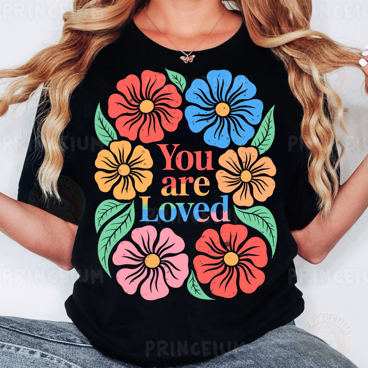 a woman wearing a t - shirt that says you are loved