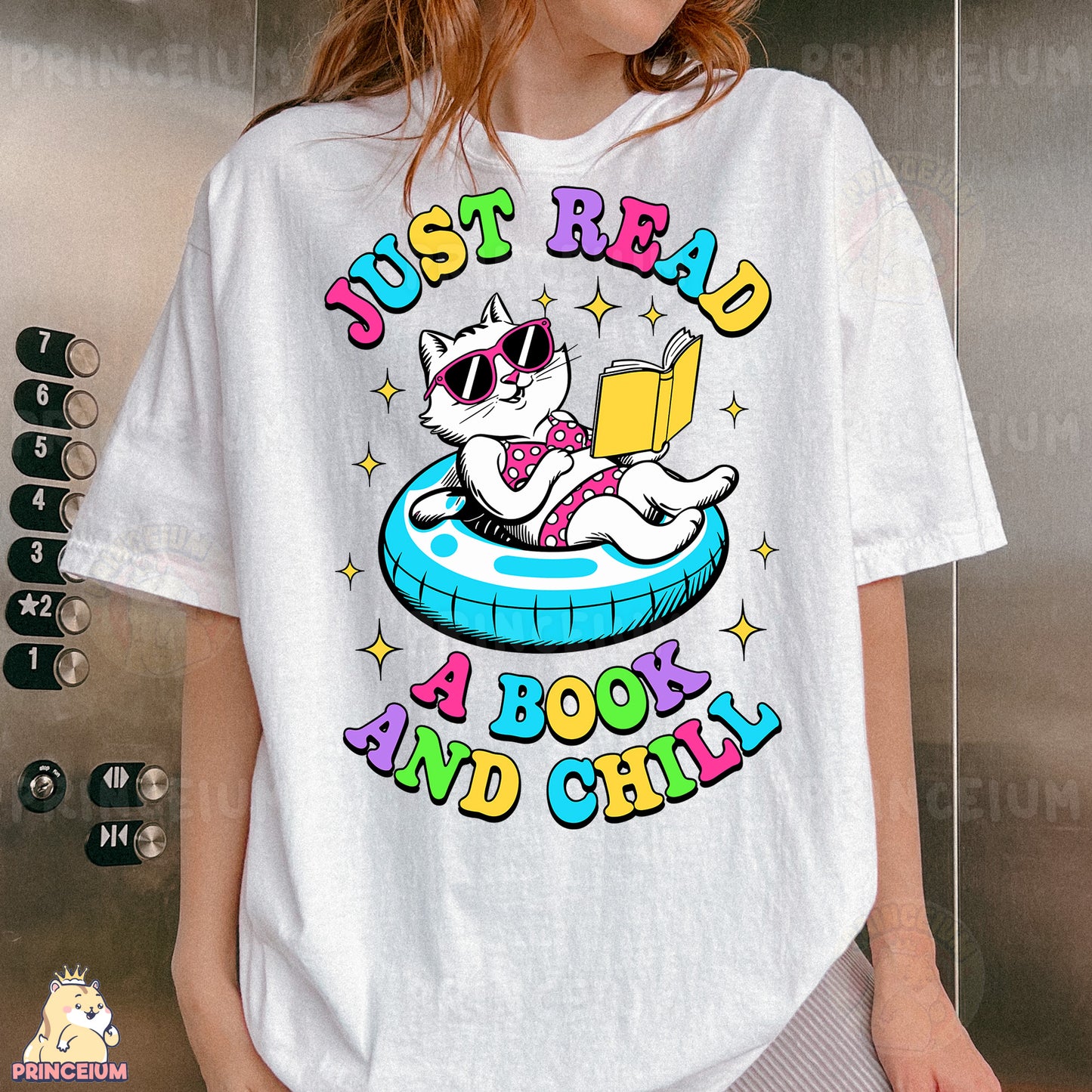 a woman wearing a t - shirt with a cat reading a book